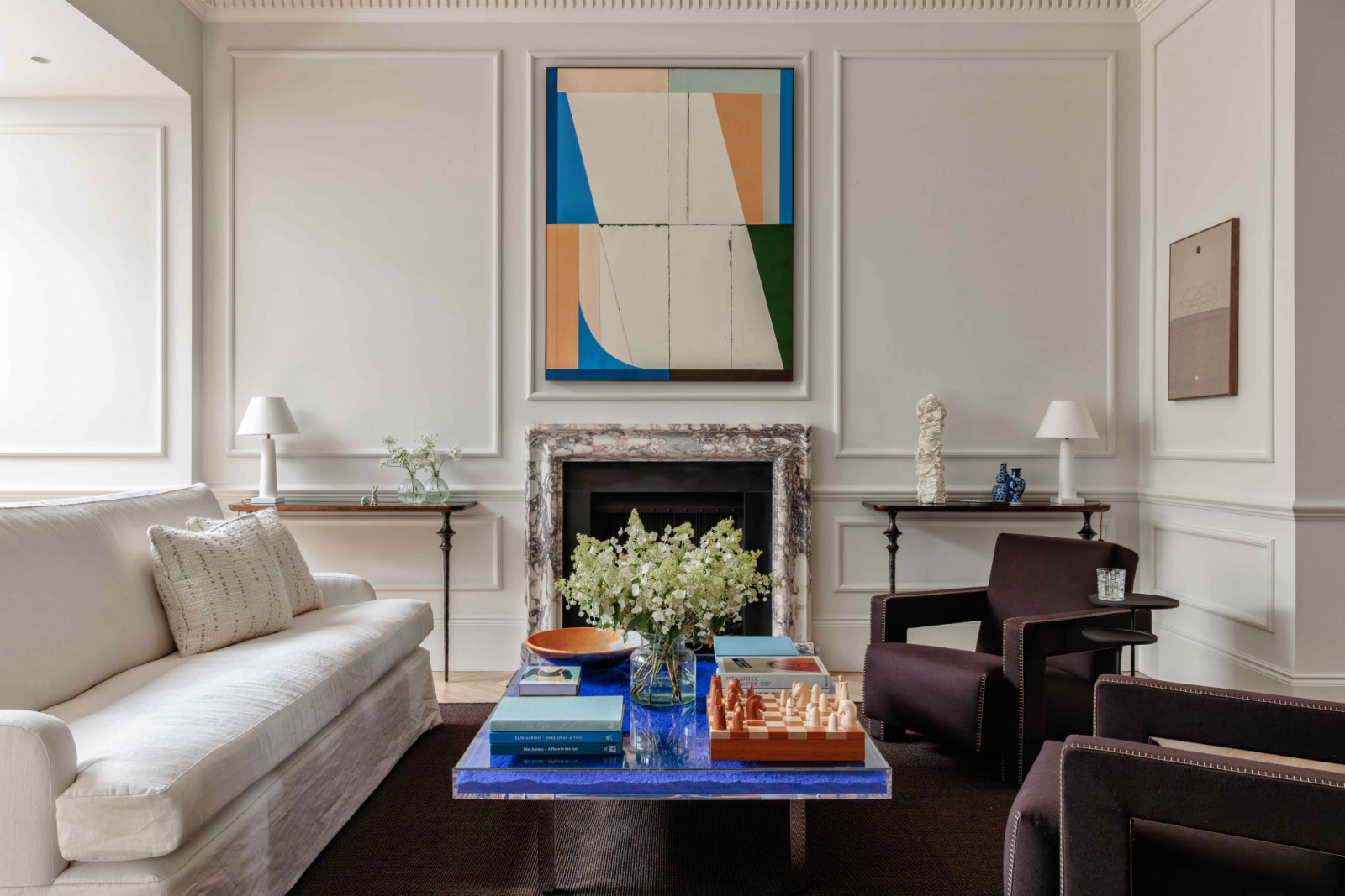A sophisticated palette of neutral tones is enlivened by joyful pops of colour