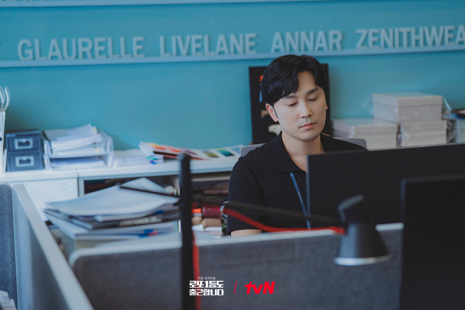 An employee at his desk embodies the continuing value of daily work and consistent effort.