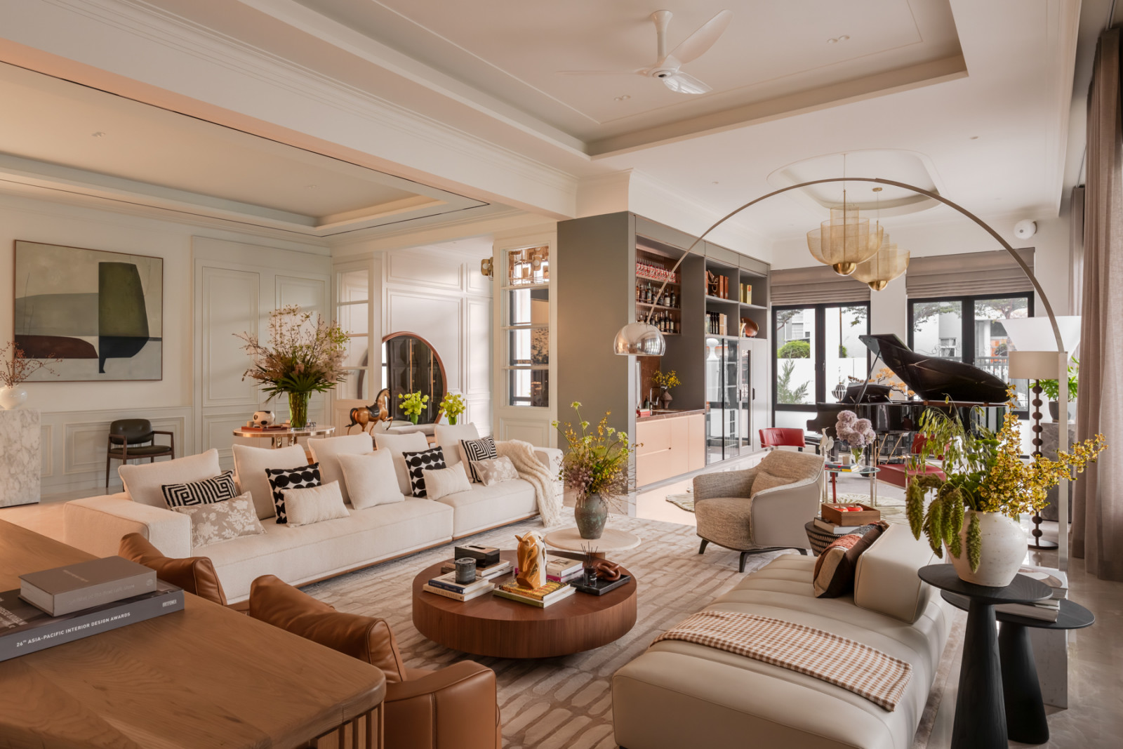 The ground floor’s piano lounge sits adjacent to the bar and wine cabinet, within view of the main living area
