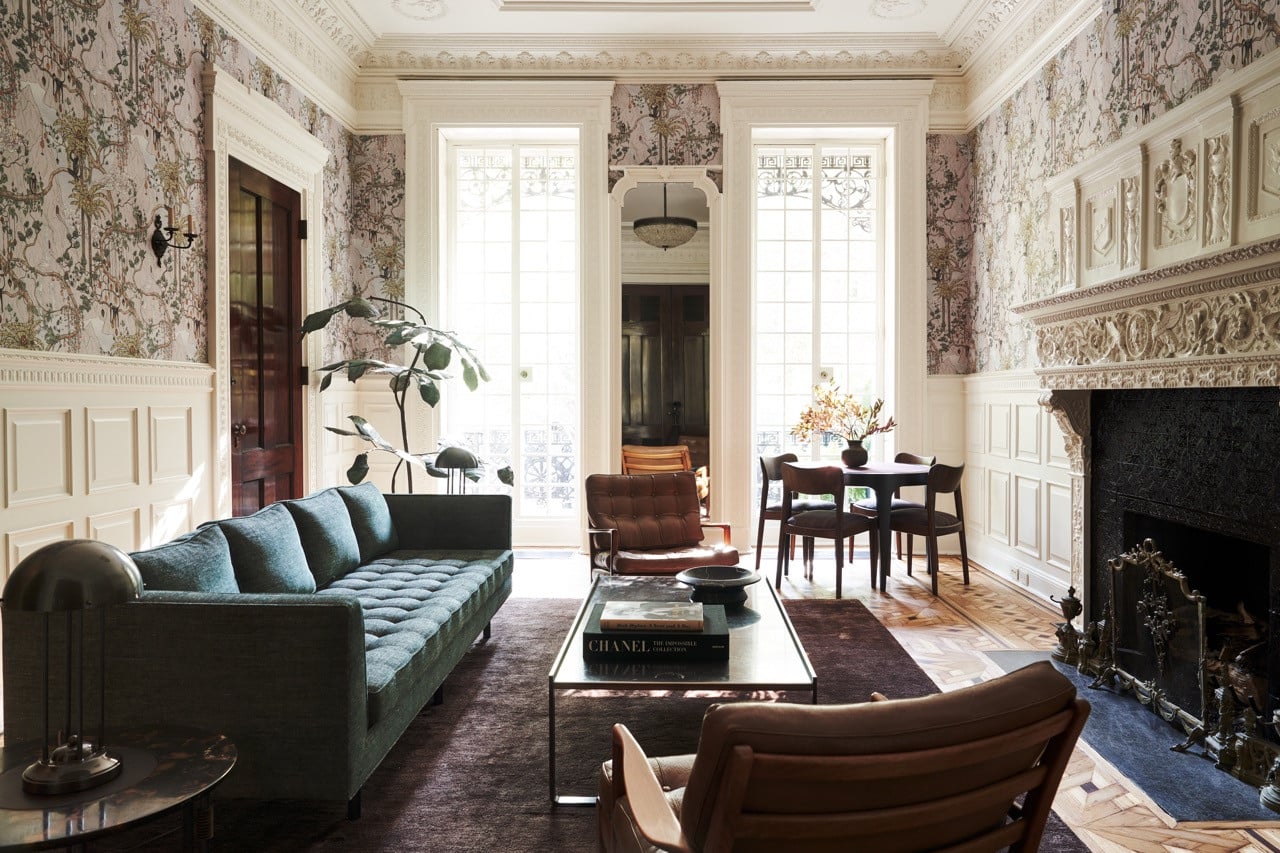 The parlour floor, hung with the David Wiseman wallpaper, its plasterwork ceiling and marble mantel intact, opening onto the entrance hall