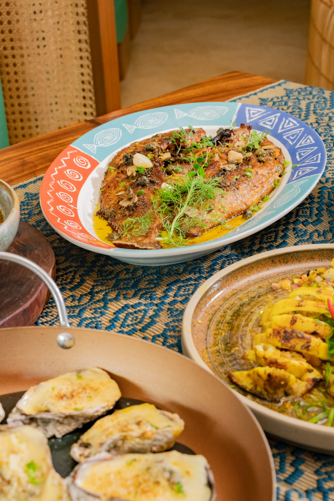 A delectable feast of seafood at Coquito Boracay, with the baked fish [rename] on display