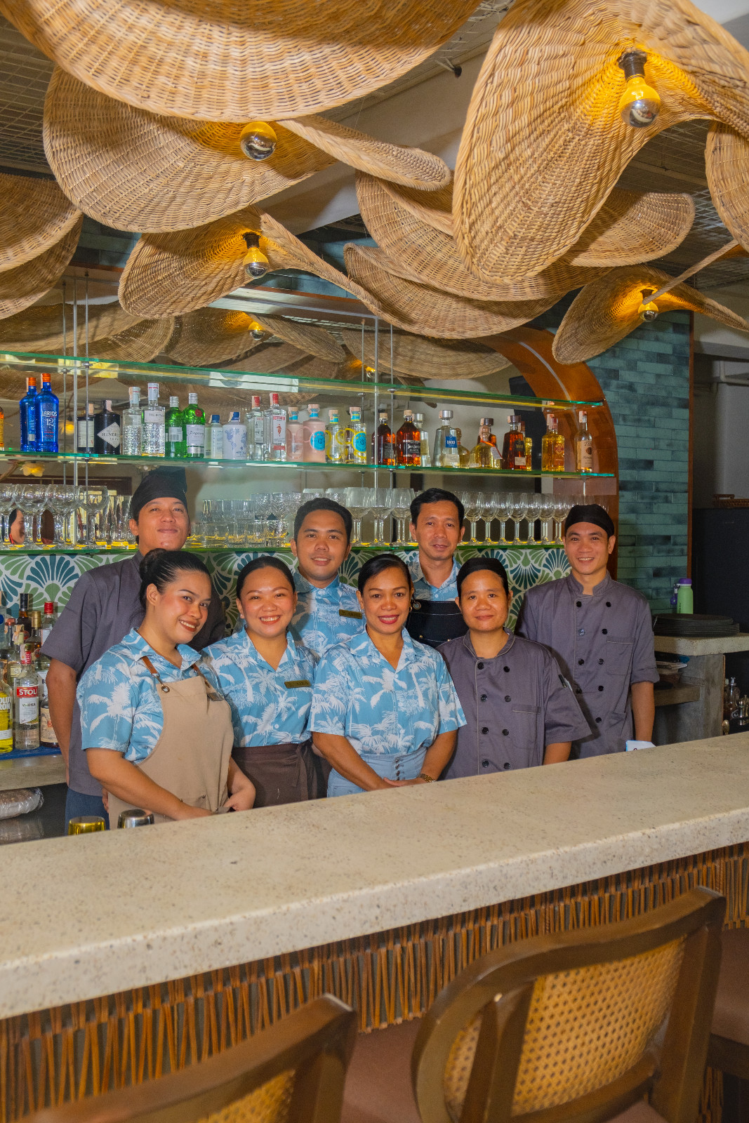 The welcoming staff of Coquito Boracay posing at the bar