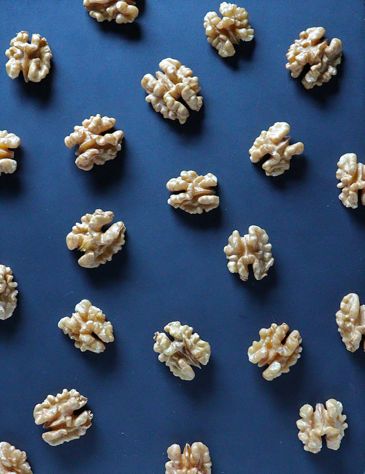 Shelled walnut halves, instantly recognizable, offer a subtly bitter, earthy taste ideal for both sweet and savory creations.
