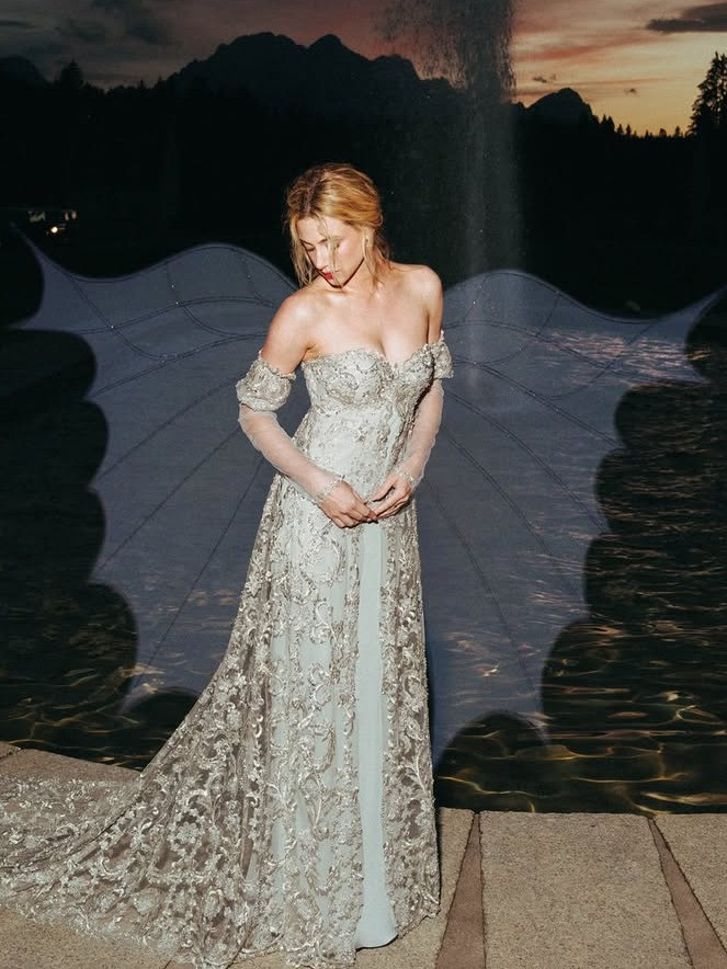 Lili Reinhart wearing a silver-beaded Rodarte gown recreating Drew Barrymore’s Ever After ball gown look for The Love Hypothesis press tour in Germany