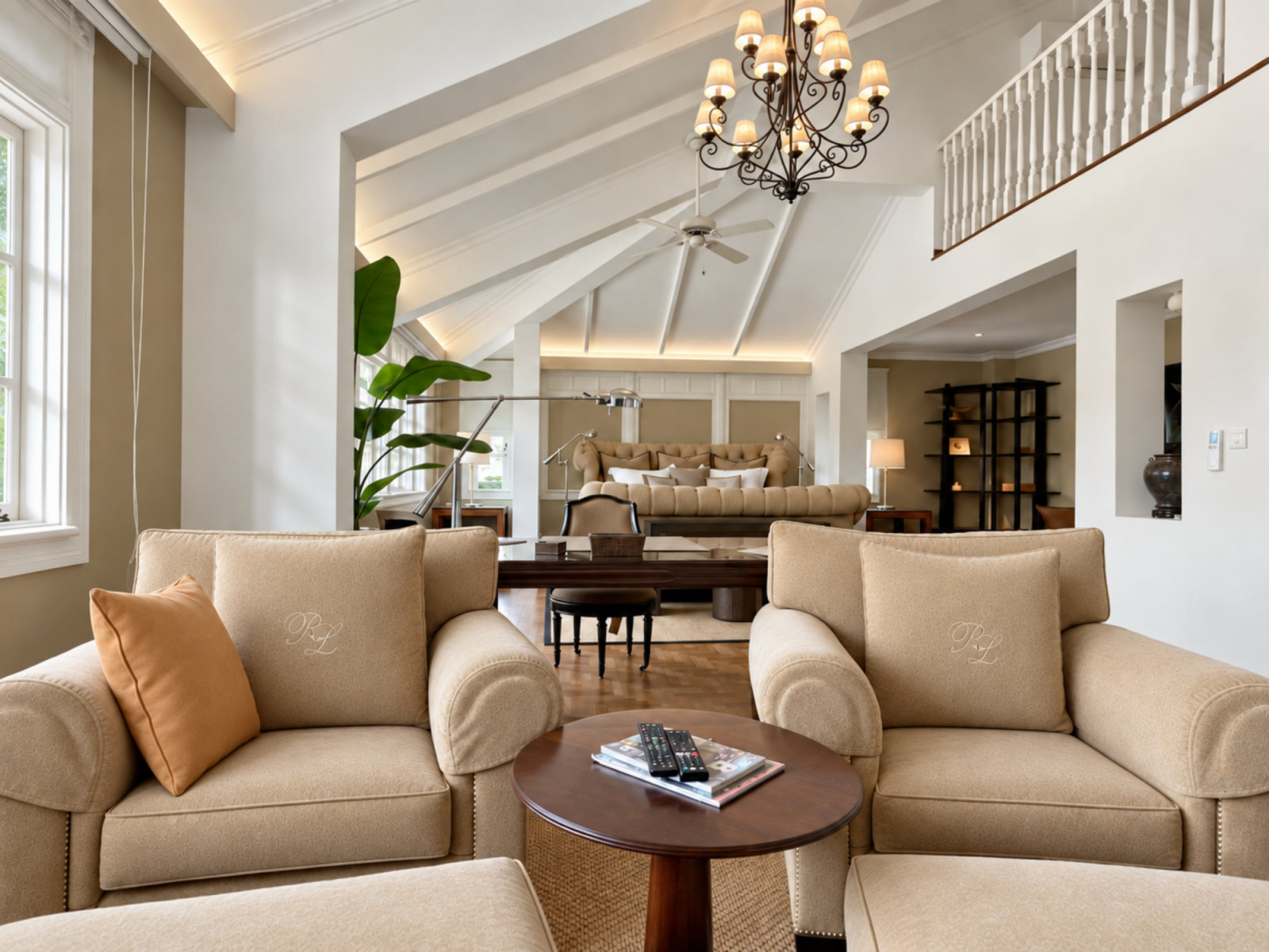 The master suite, nestled under a pitched ceiling with exposed timber rafters, is cloaked in a restrained, neutral colour palette