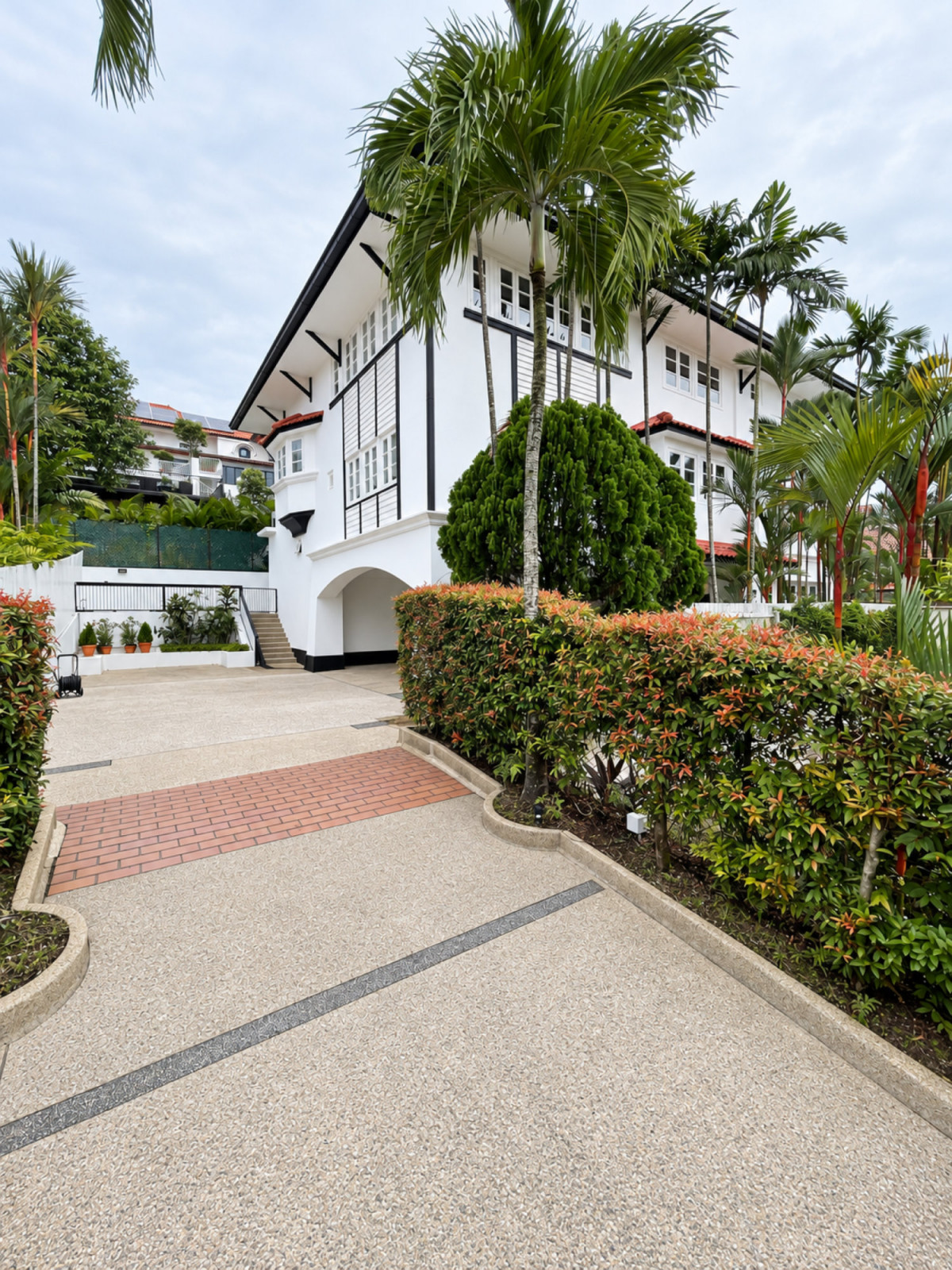 The exterior of the black-and-white bungalow
