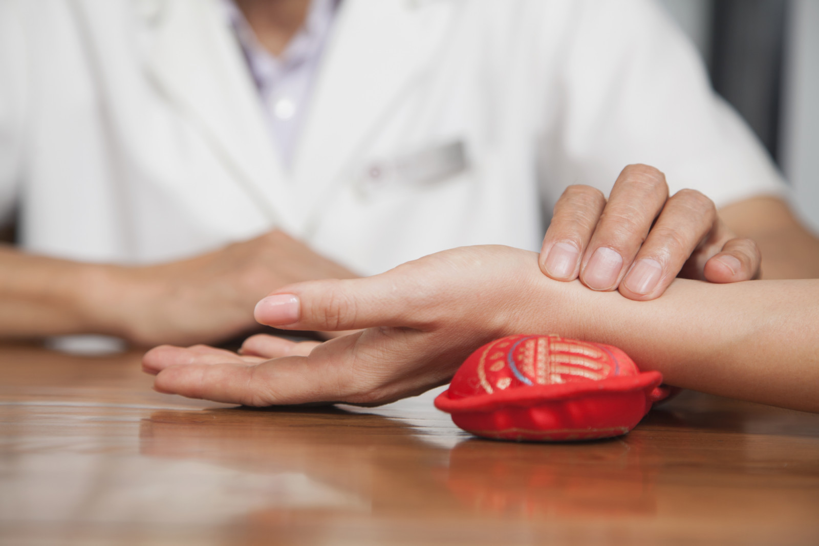 Close up of man checking woman's pulse