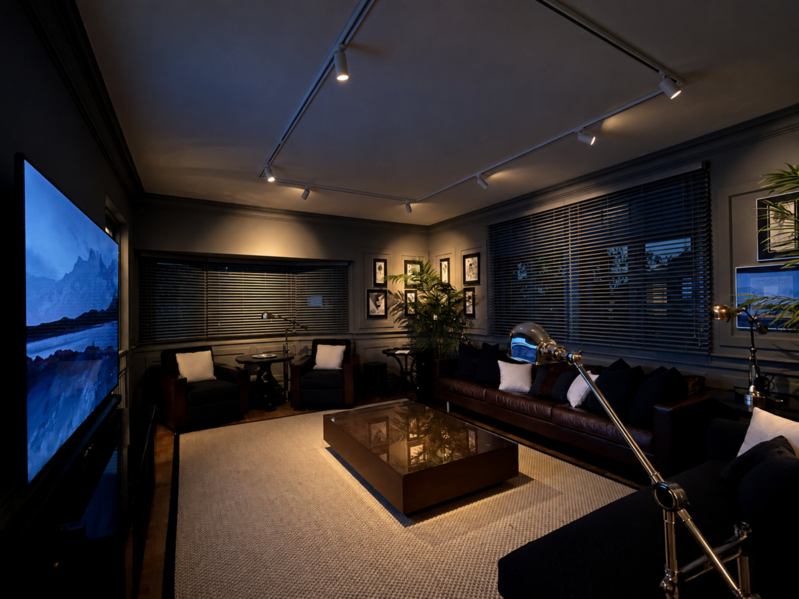 This moody, dimly lit media room is punctuated by silver trophies and silver-framed vintage newspaper advertisements from French fashion houses