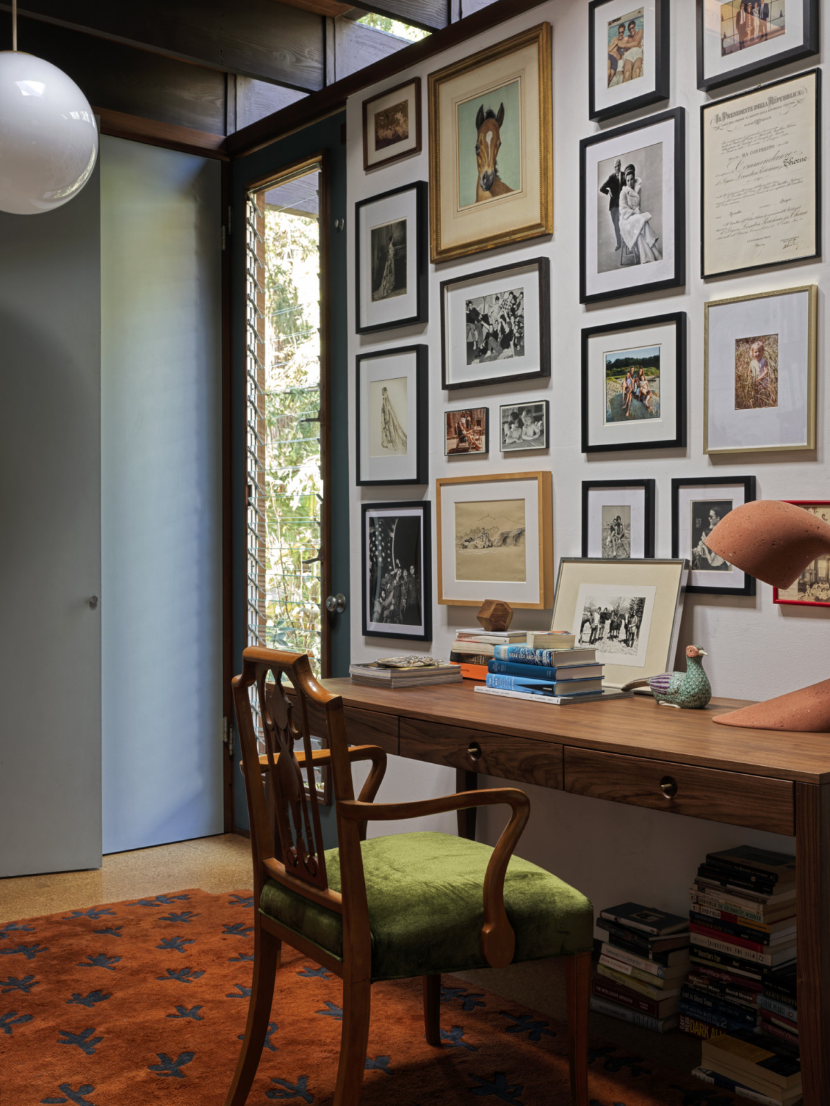 The gallery wall in the home office of the California home designed by Kate Driver of West Haddon Hall