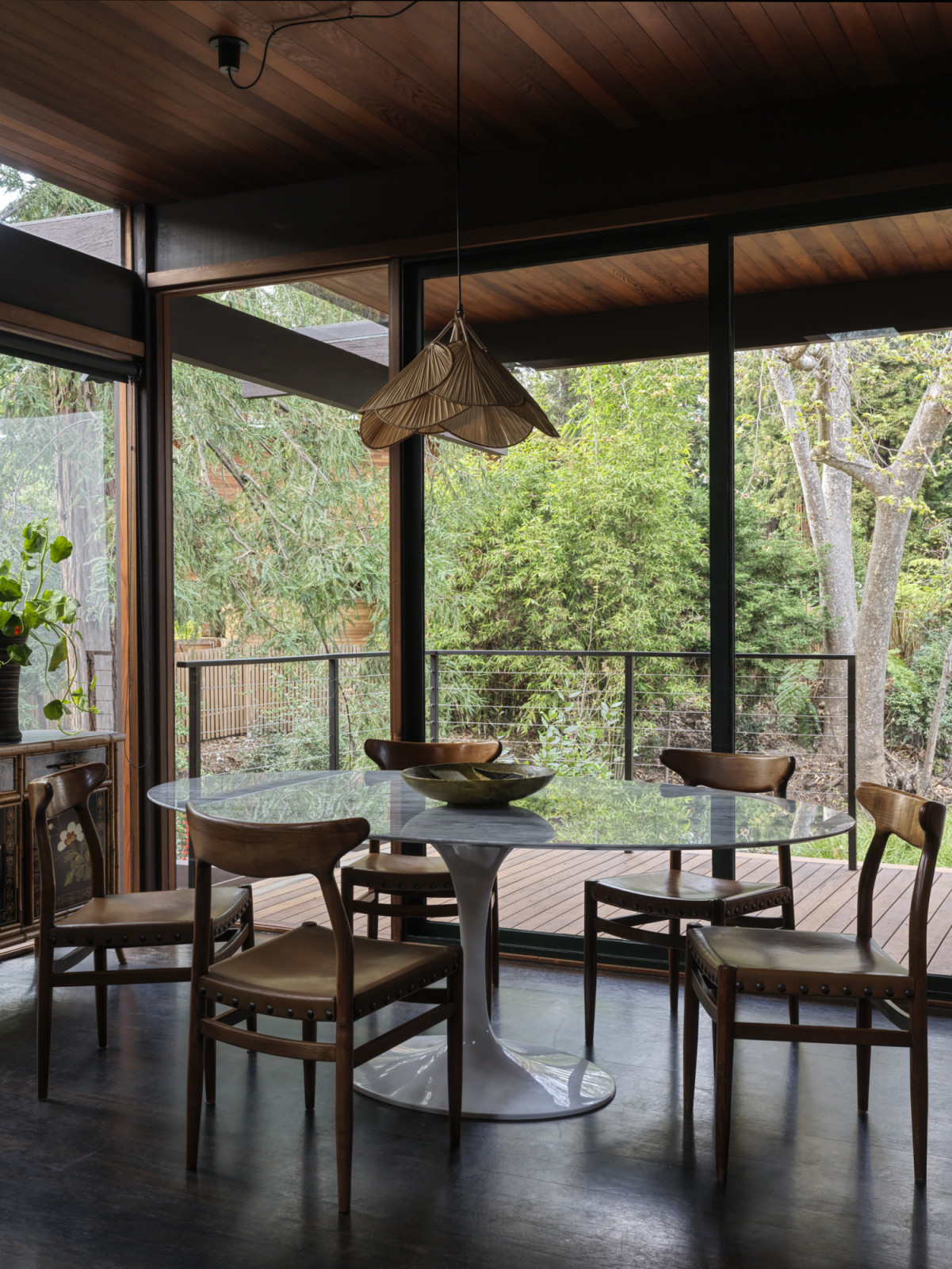 The breakfast Nook overlooking the backyard and creek in the California home designed by Kate Driver of West Haddon Hall