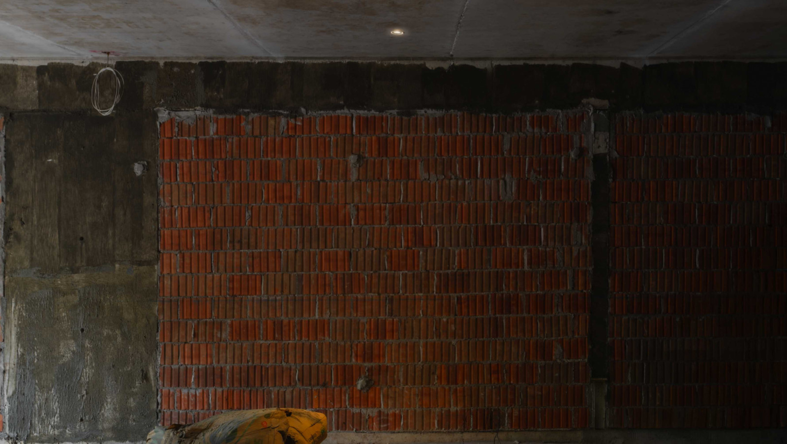 Sol Luminaire’s Aeon Halo V2.5 Trimless lends an invisible finishing touch to this raw wall