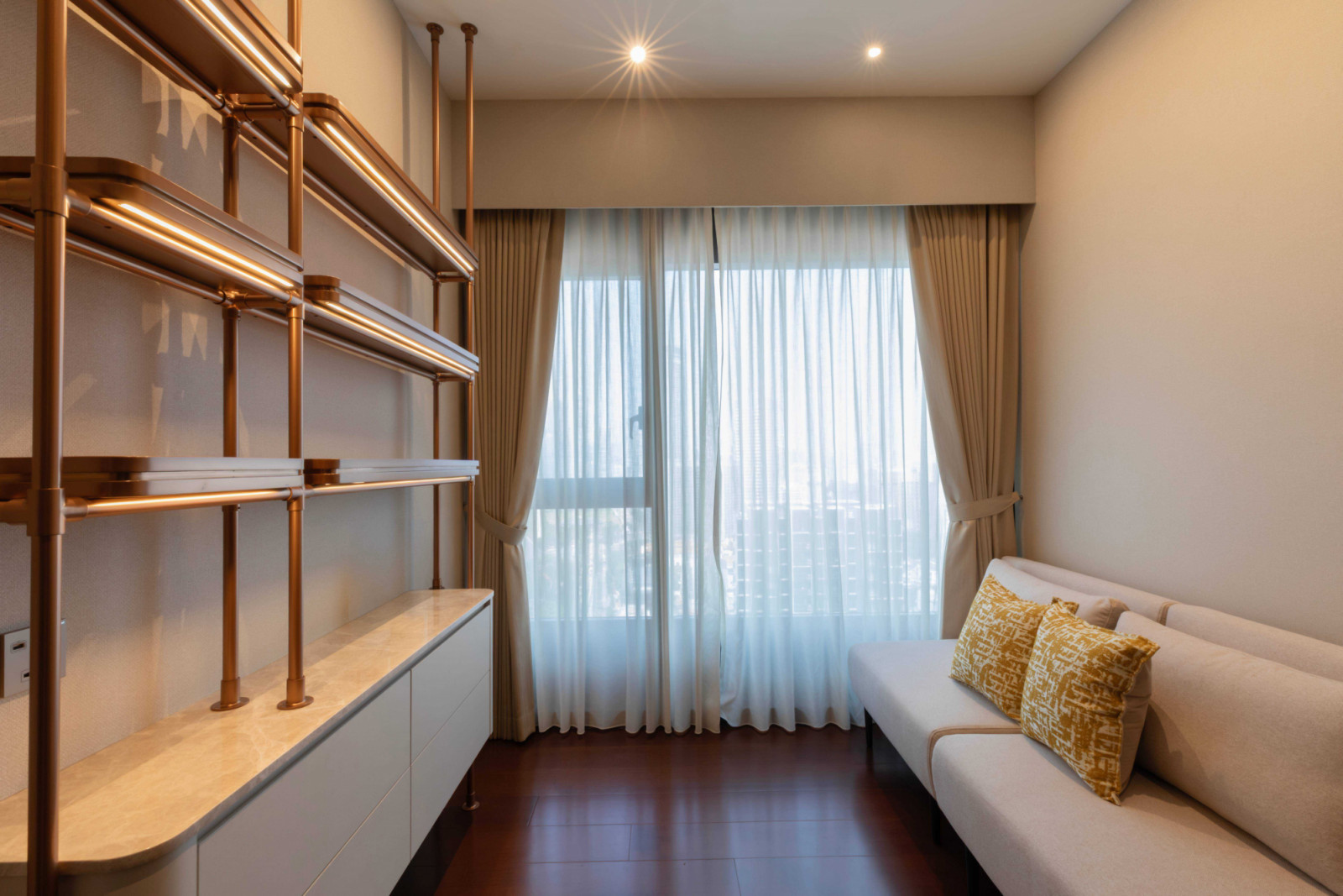 The apartment’s guest room, fitted with extra shelves for the wife’s book collection