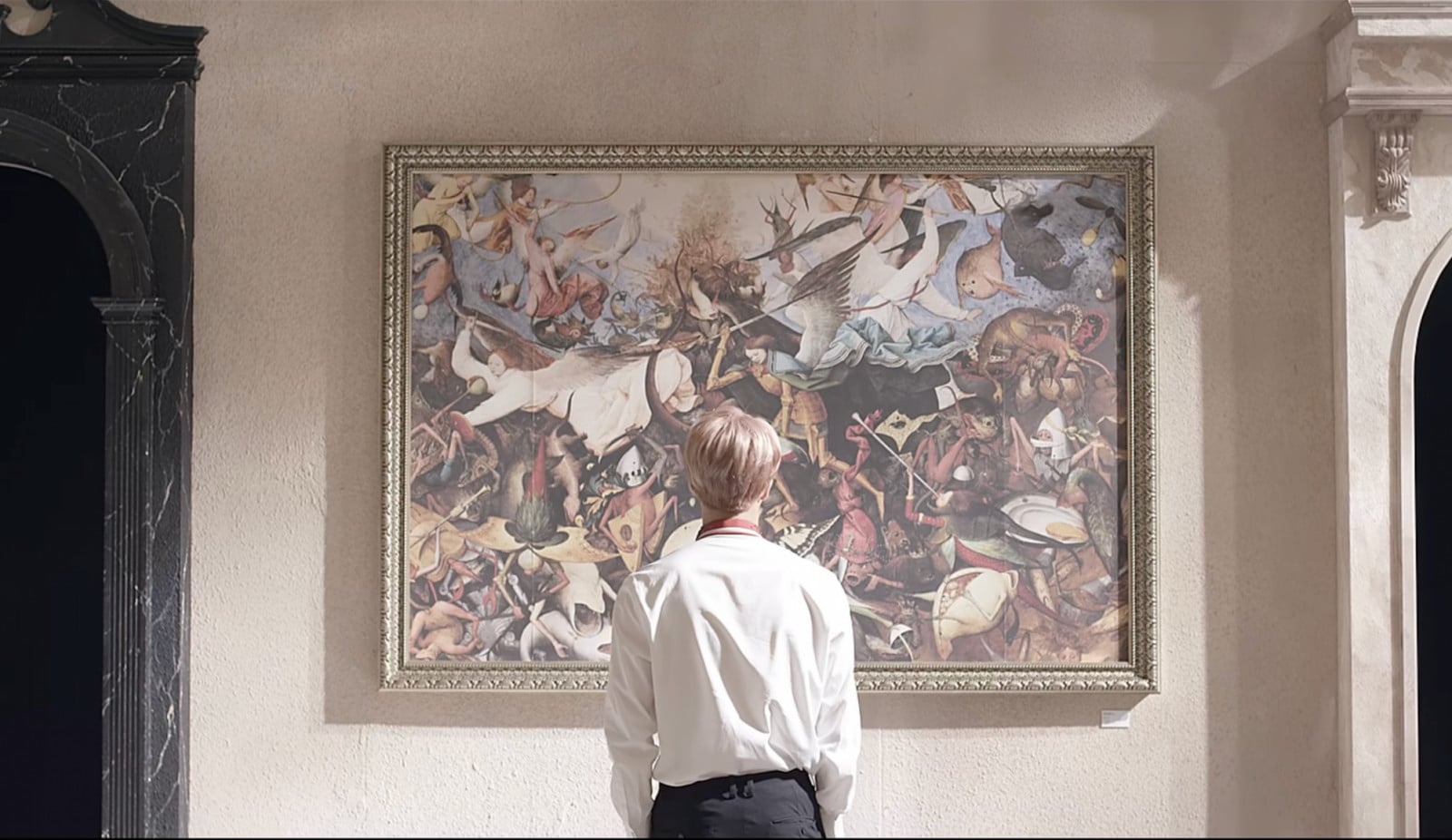 Jimin of BTS views Bruegel's 'The Fall of the Rebel Angels' from their 'Blood Sweat & Tears' music video.
