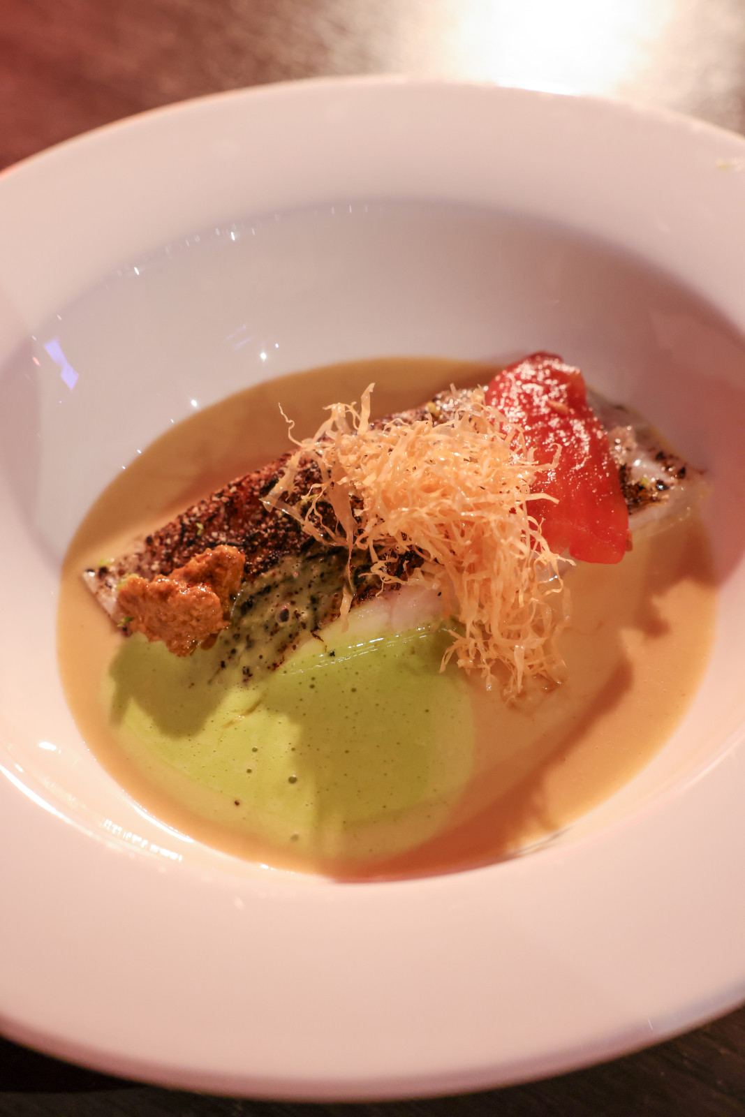 Kasama by chef JP Cruz featured succulent apahap with kampot pepper, aligue sauce, soybean skin, atcharang smoked tomato and malunggay | Off Menu 2026