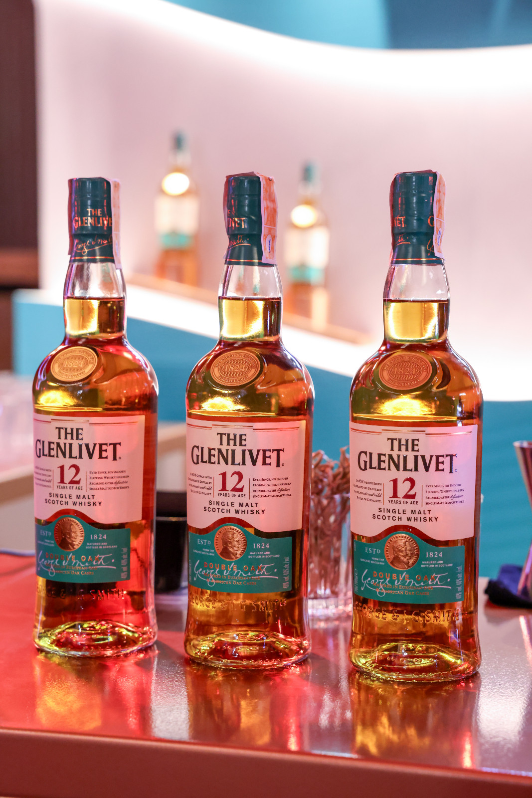 Bottles of The Glenlivet 12 Years of Age Single Malt Scotch Whisky, a favored addition to curated beverage lists.