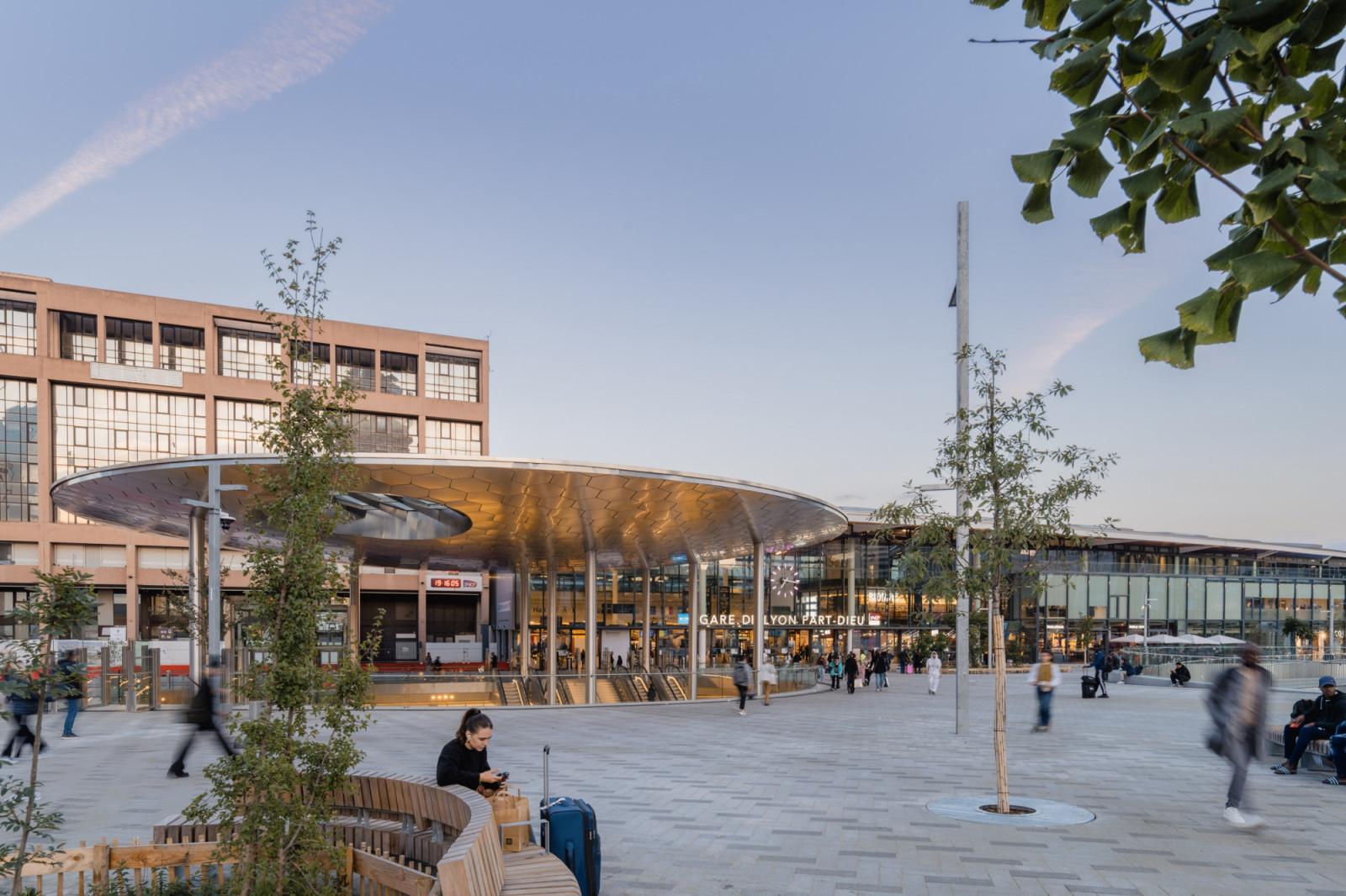 At dusk, the lit underside of the circular canopy reflects in its hexagonal panels at the entrance to Gare de Lyon Part-Dieu (Photo: Romuald Nicolas)