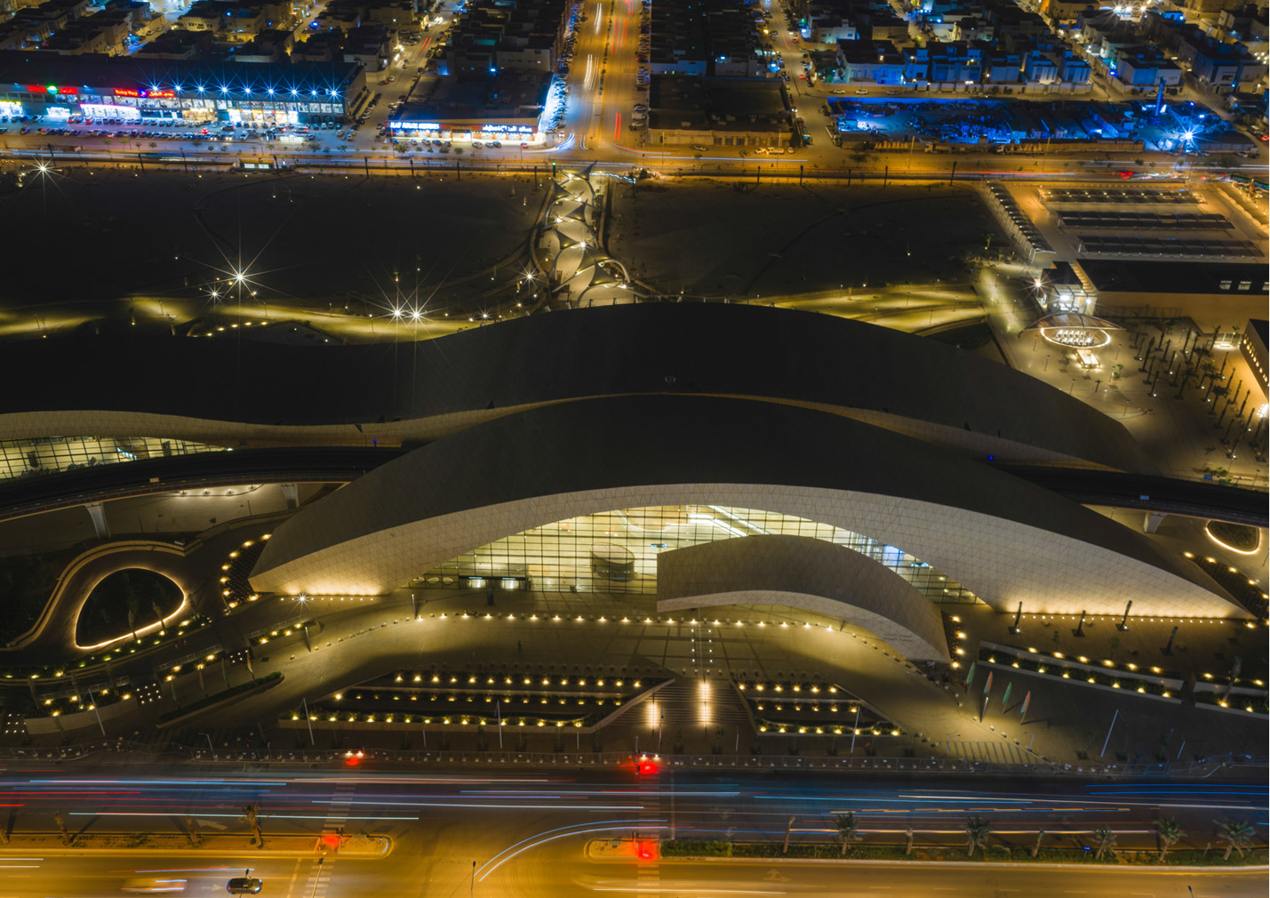 At night, lights trace the undulating roofs and planted plazas of Western Station, Omrania’s Prix Versailles Most Beautiful Stations 2026 laureate in Riyadh (Photo: Omrania)