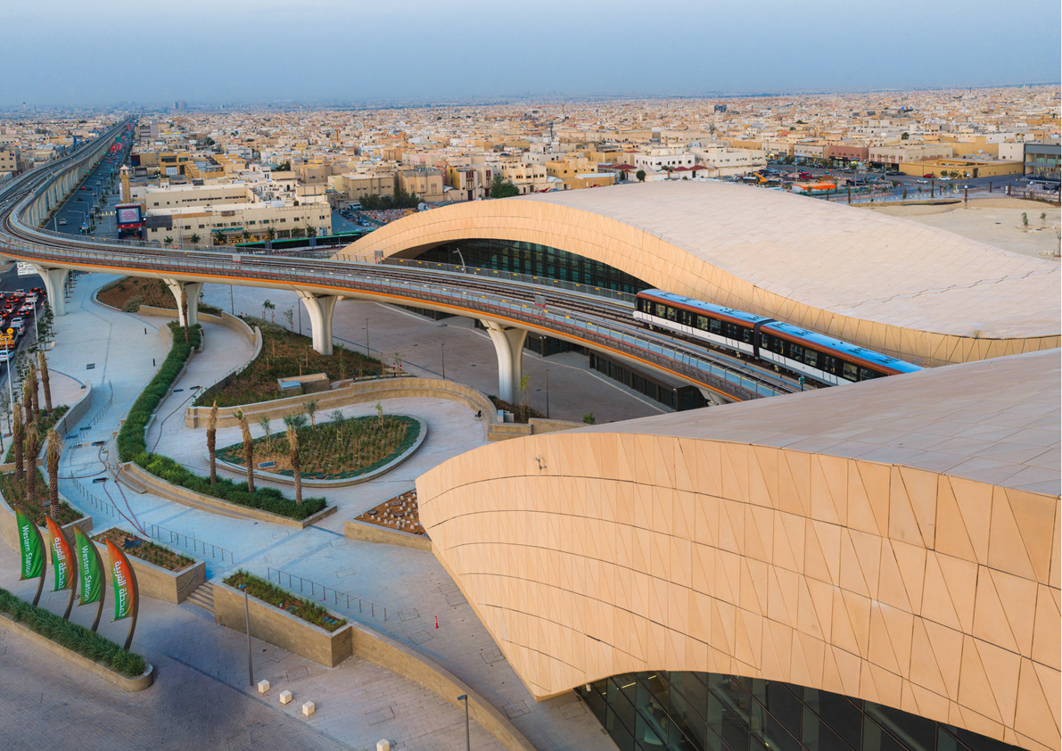 The dune-inspired roofs of Omrania’s Western Station in Riyadh curve over a glazed entrance (Photo:Omrania)