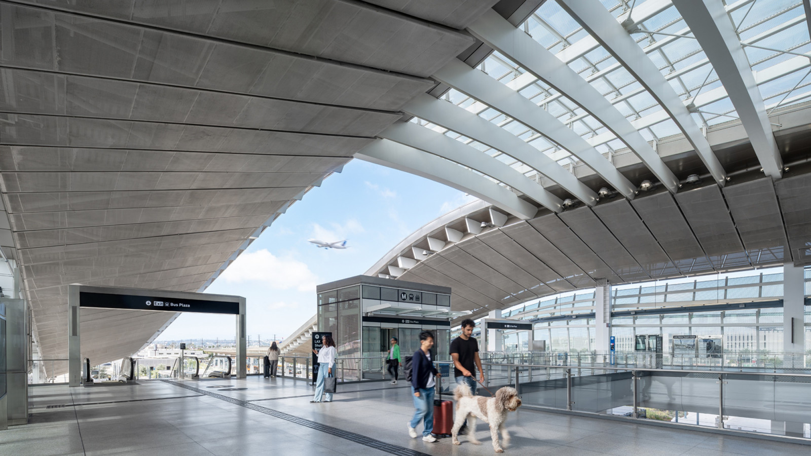 An opening between the two canopy wings frames a plane on its approach above the mezzanine of the LAX/Metro Transit Center in Los Angeles (Photo: Jason O’Rear)