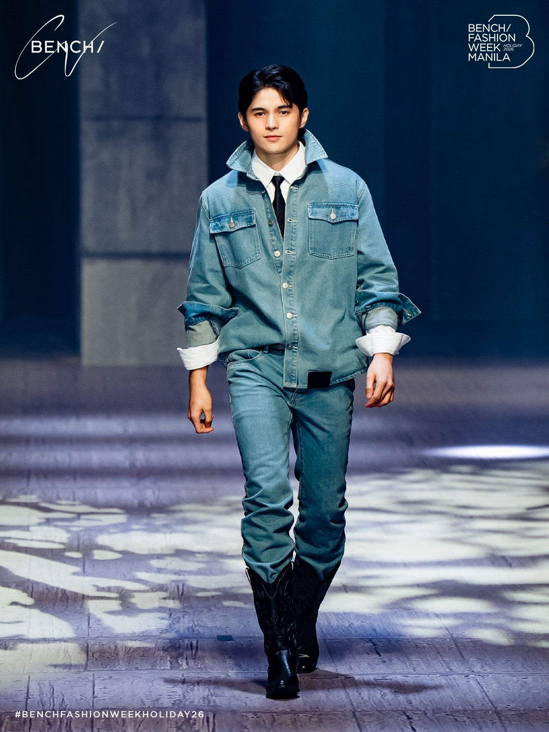 A model showcases a denim ensemble from Bench's Holiday 2026 collection at Bench Fashion Week Manila