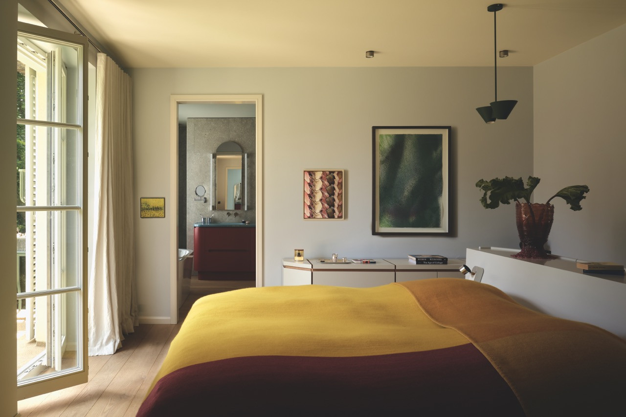 A hand-woven cashmere throw dresses the bed in one of the villa's private bedrooms