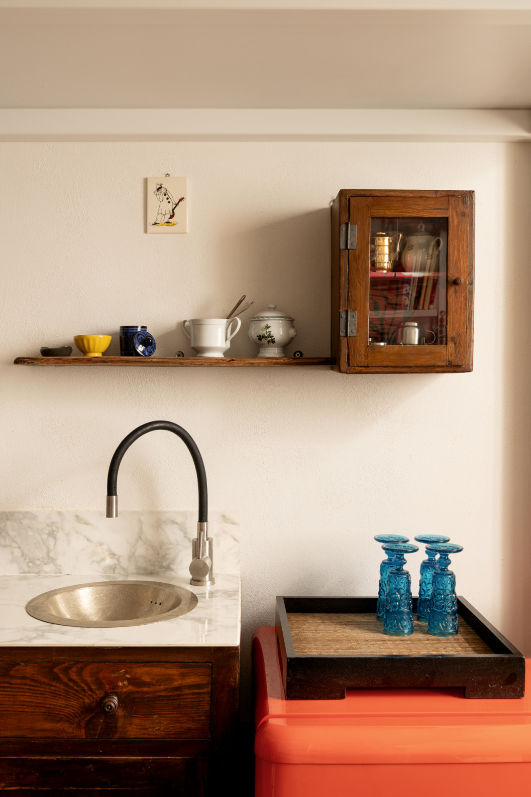 The washbasin from Morocco sits atop an old sideboard that belonged to Egle’s great-grandmother