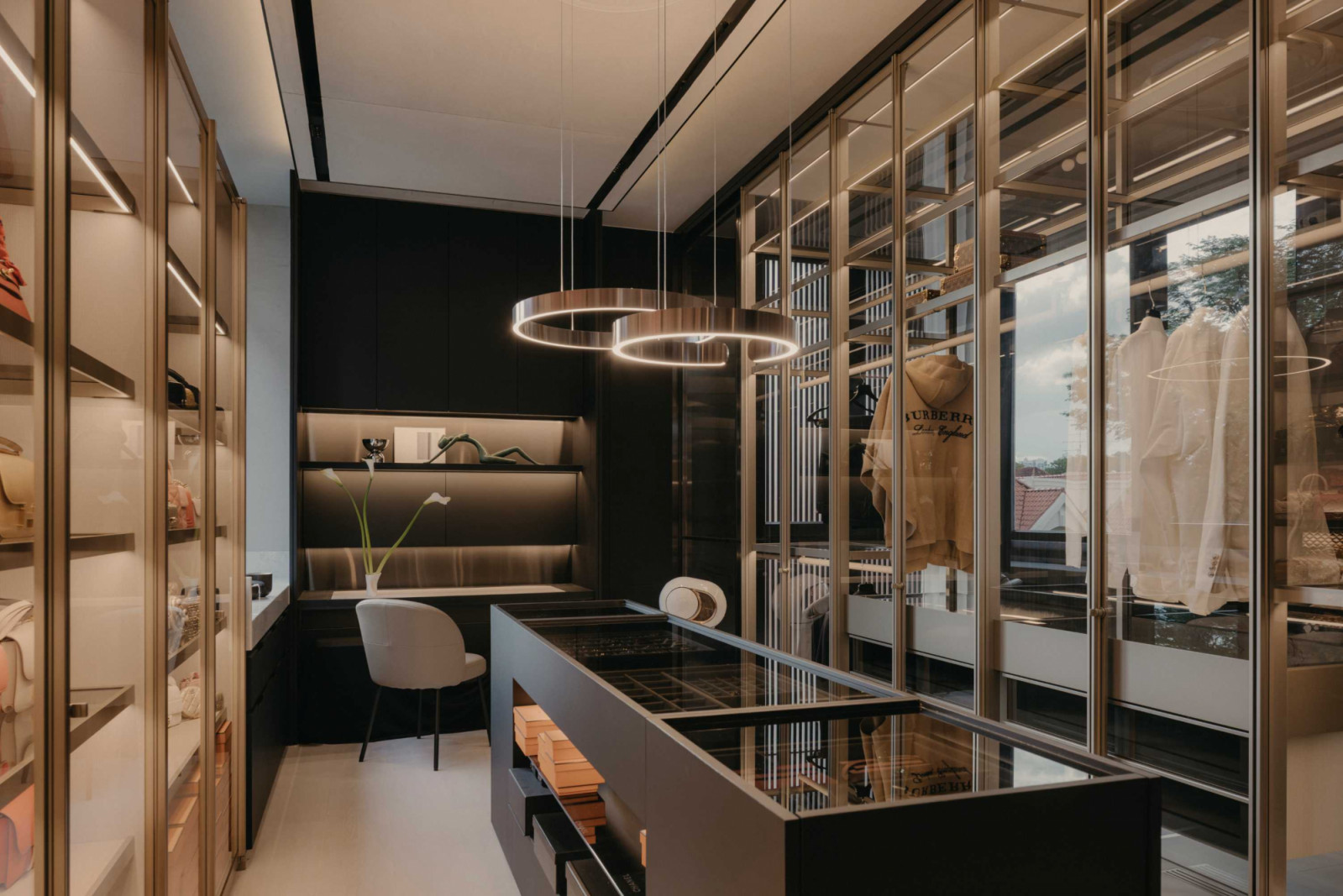 The master bedroom houses a Senzafine Ego wardrobe system from Poliform, with customised glass elements