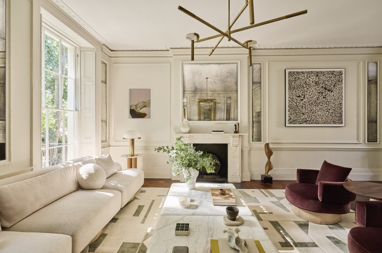 The living room, Huang’s favourite space, combines a curved bouclé sofa, burgundy velvet armchairs and a geometric rug from the Rug Company