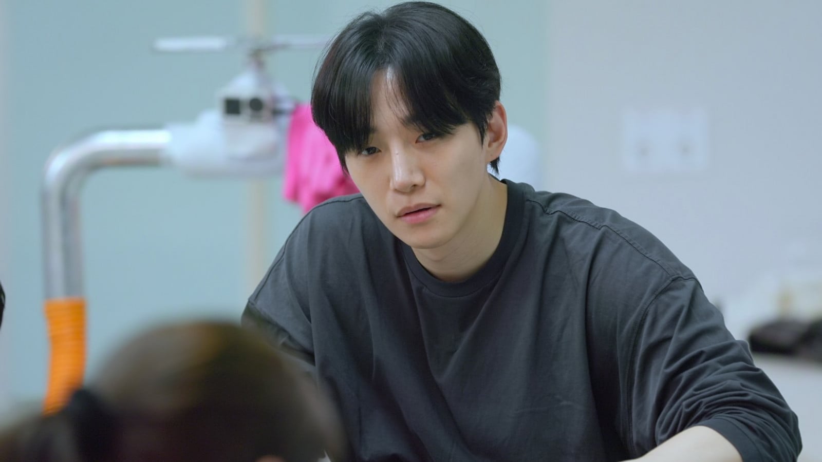 Lee Jun-ho as a guest house staff member in Netflix's Korean variety show Kian's Bizarre B&B season two