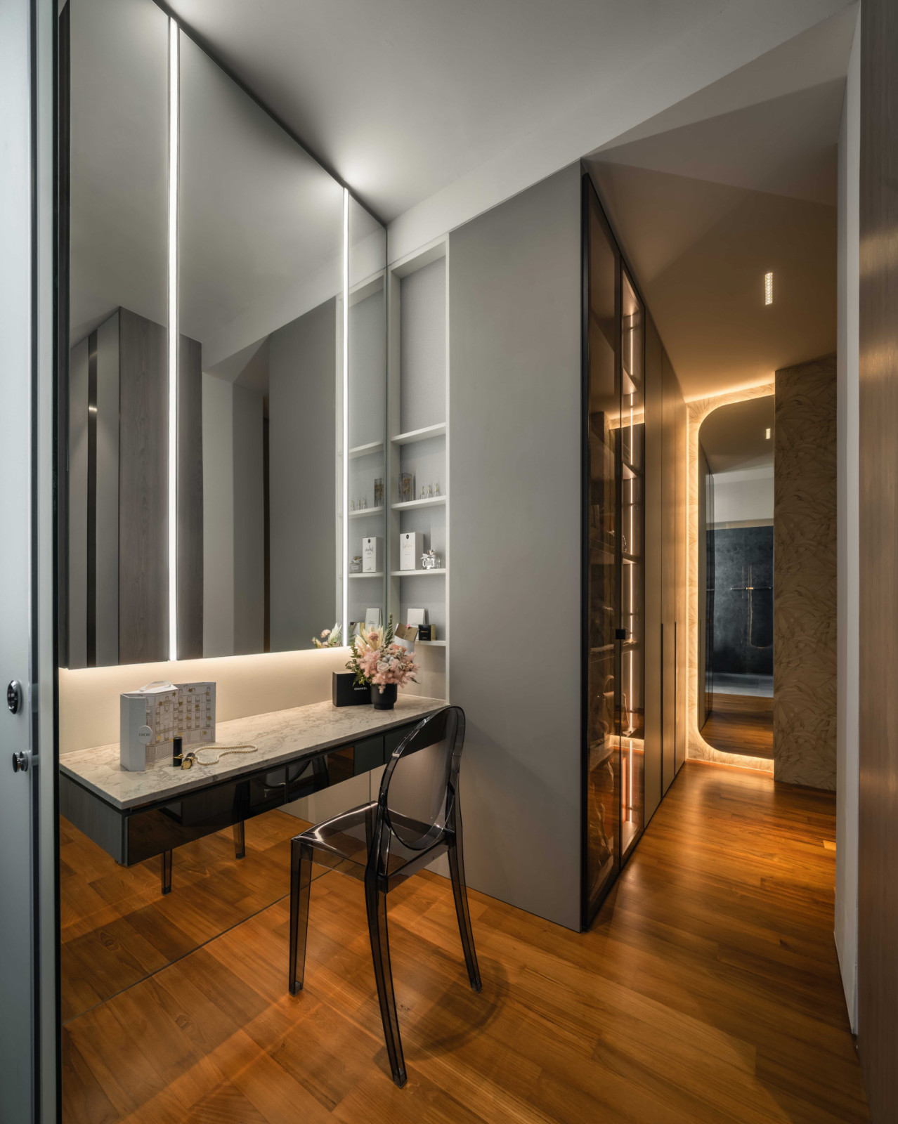 The dressing zone is fitted with a walk-in wardrobe and vanity for the wife
