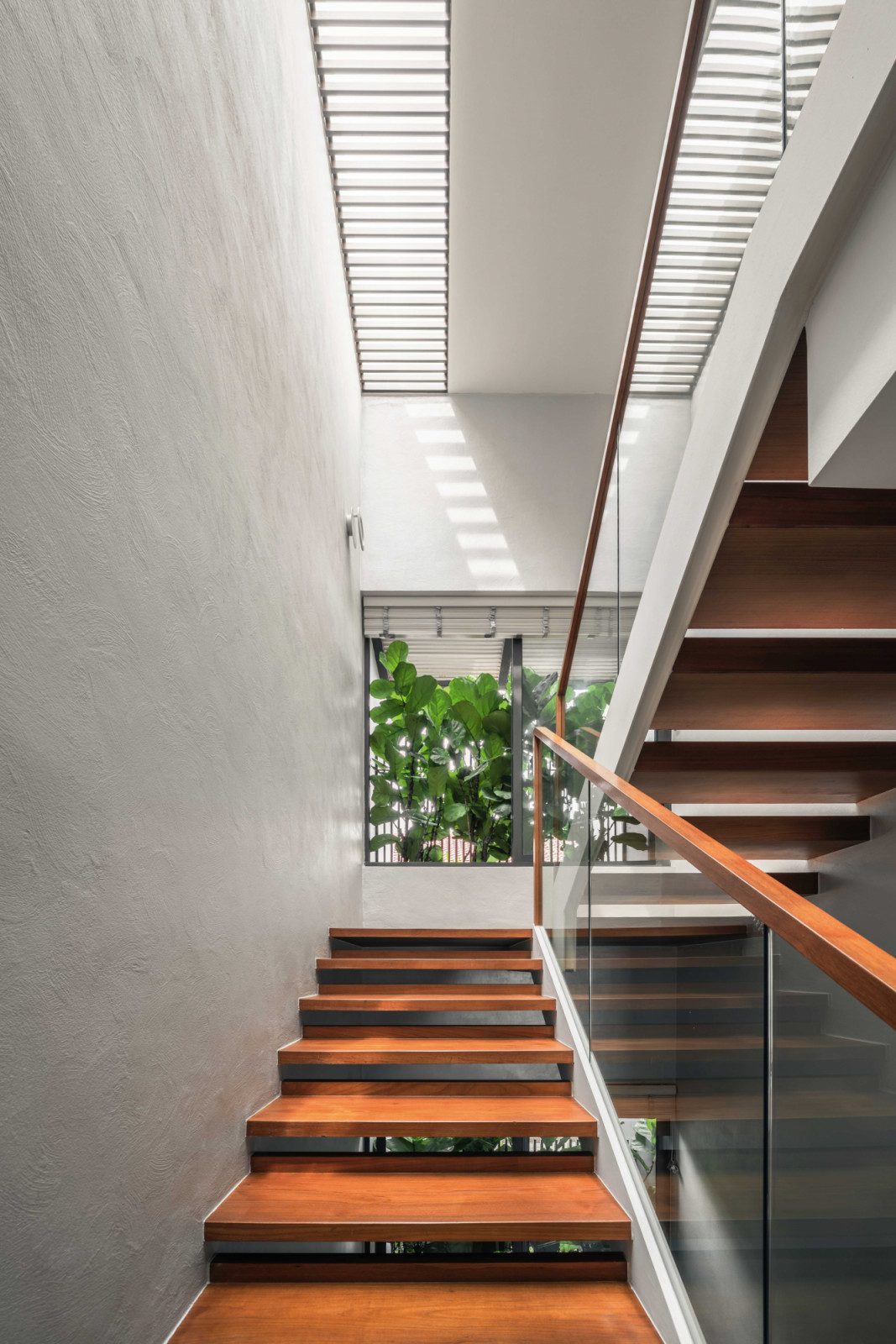 The airy stairway leading to the second floor, where the main entertainment area is located