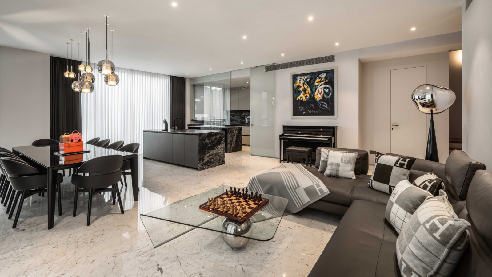 A Cattelan Italia Globe coffee table draws the eye in the main entertainment area on the second floor of this Bukit Timah home, which was designed with hosting dinners and accommodating private chefs in mind
