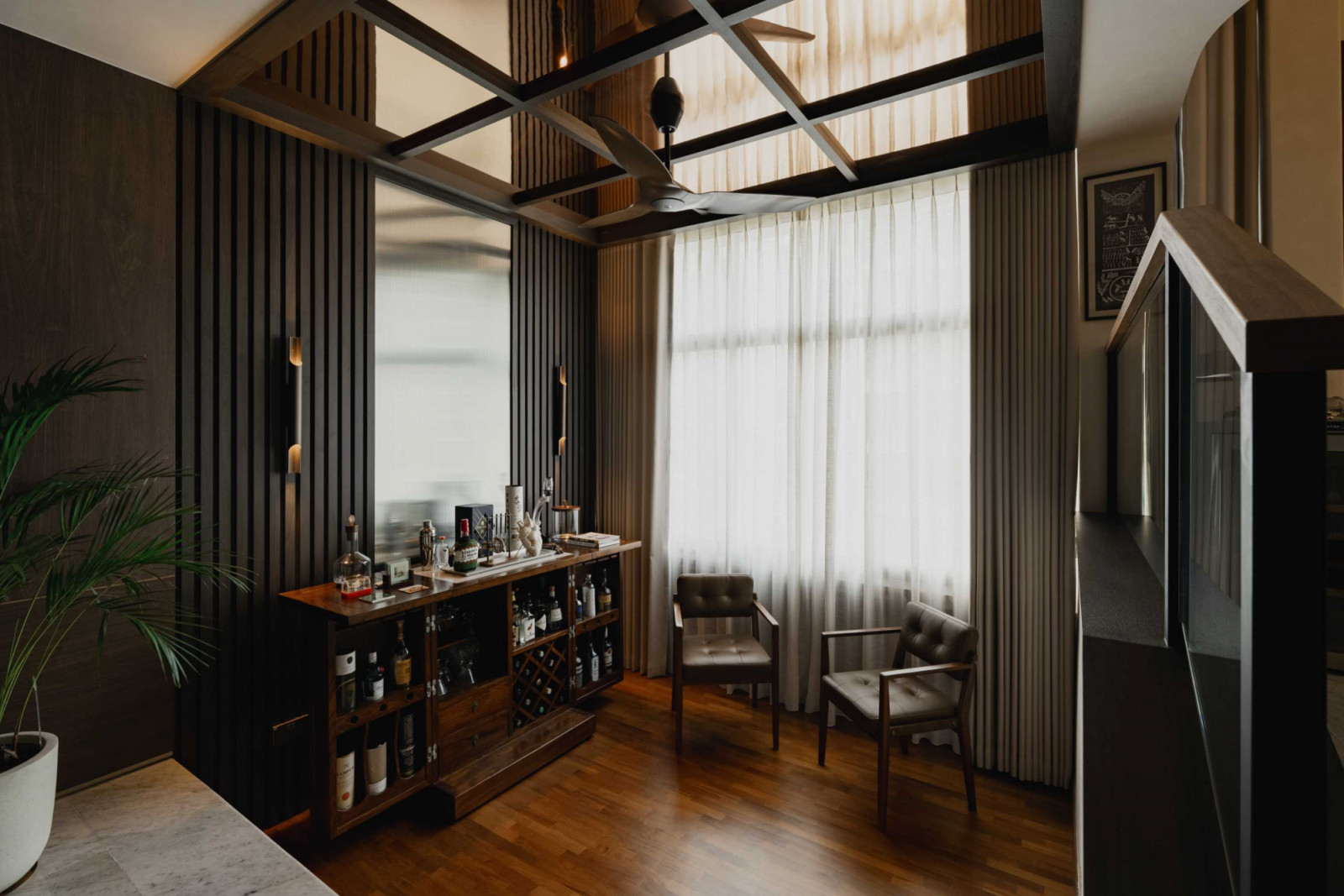 The bar area features a mirrored ceiling that creates another play on reflected evening light
