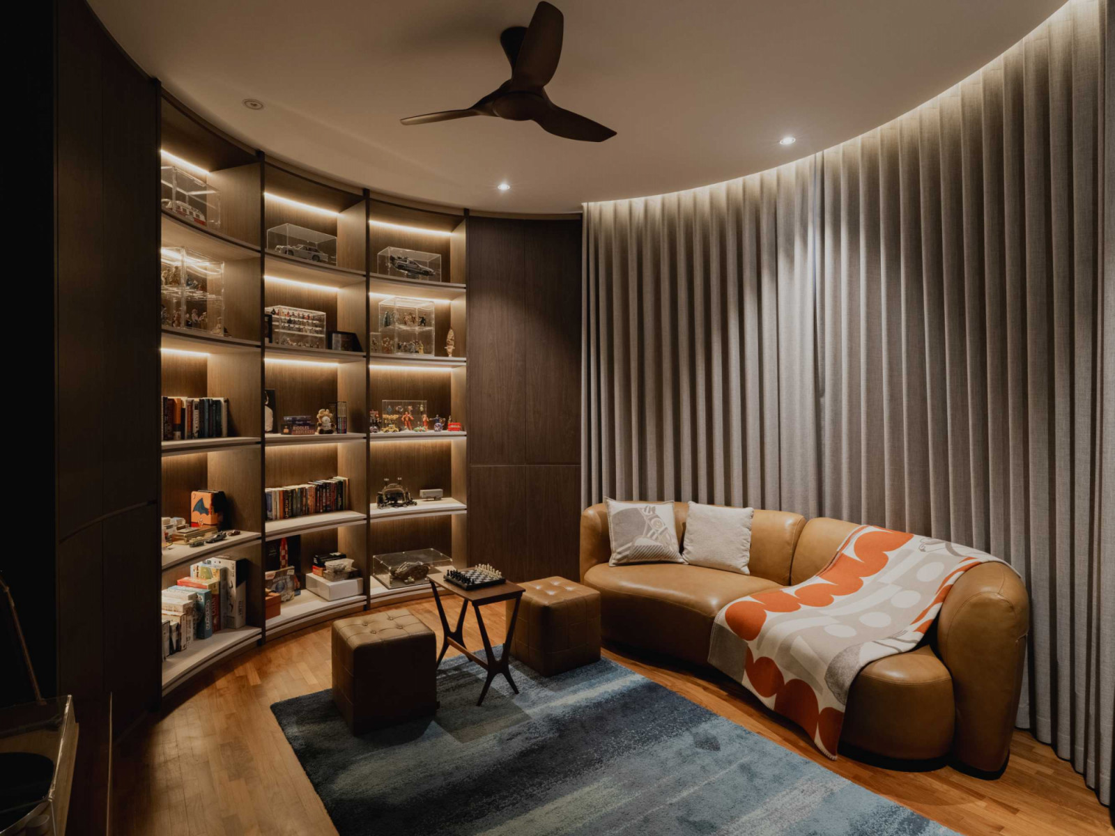 A mix of concealed illumination and recessed lights produces a pleasant radiance throughout the home