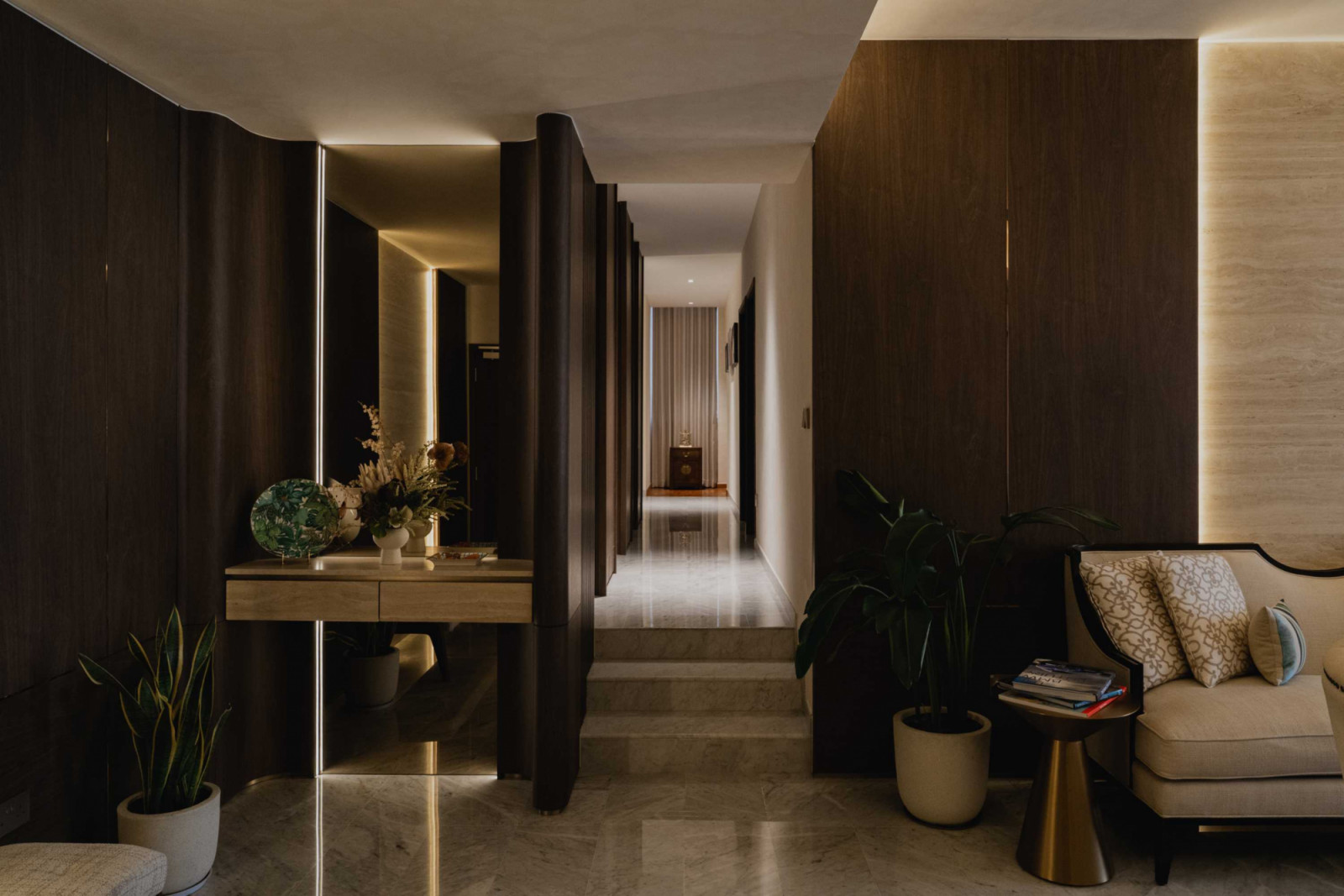 Backlights create glowing focal points along this corridor