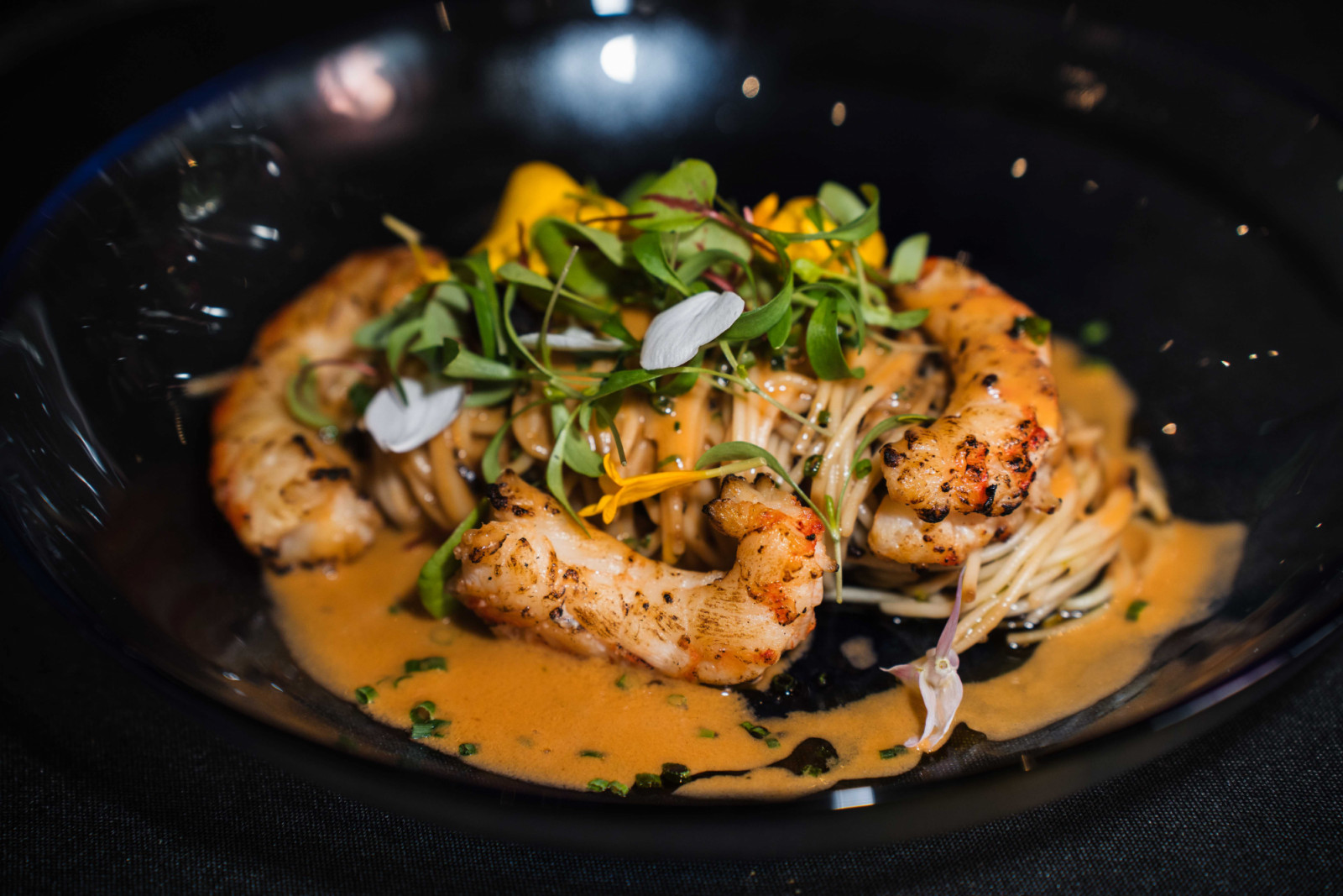 Chilled angel hair pasta with seaweed, charred Argentinian prawns and lobster bisque