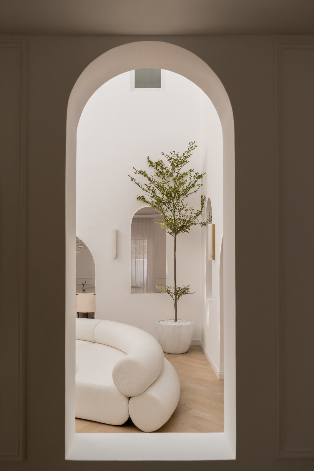 A sequence of soft, sculptural arches drew from Moorish architectural rhythms