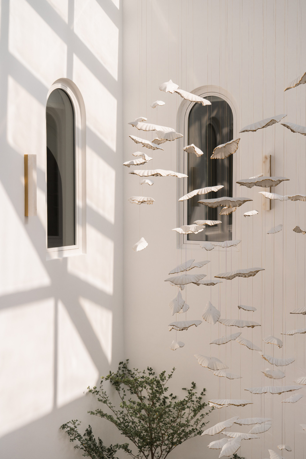 Light and shadow play through the layered openings