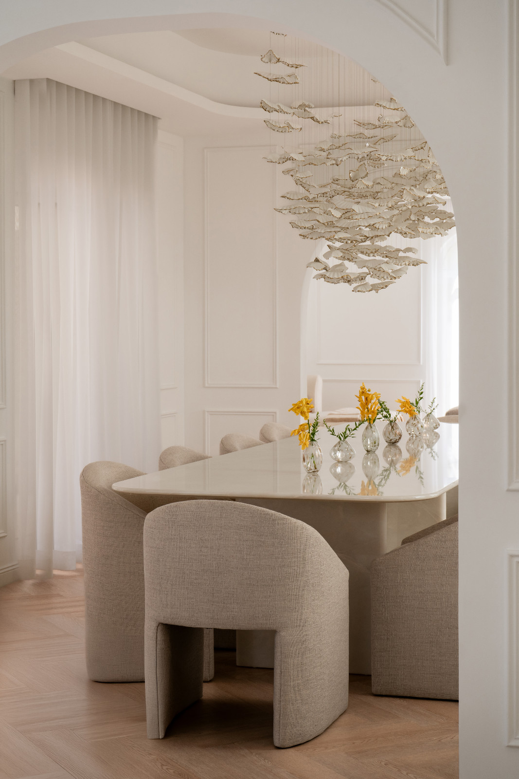 Formal dining chairs by West Elm add depth and warmth to the space
