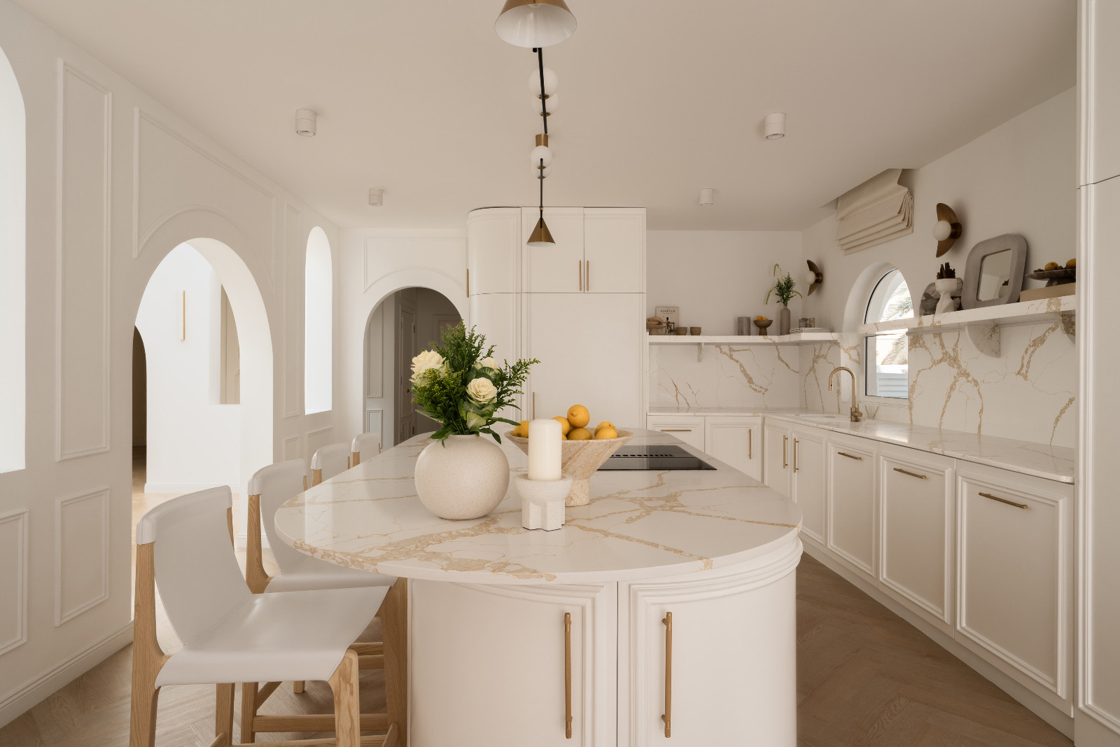 The kitchen remains within a restrained, neutral palette
