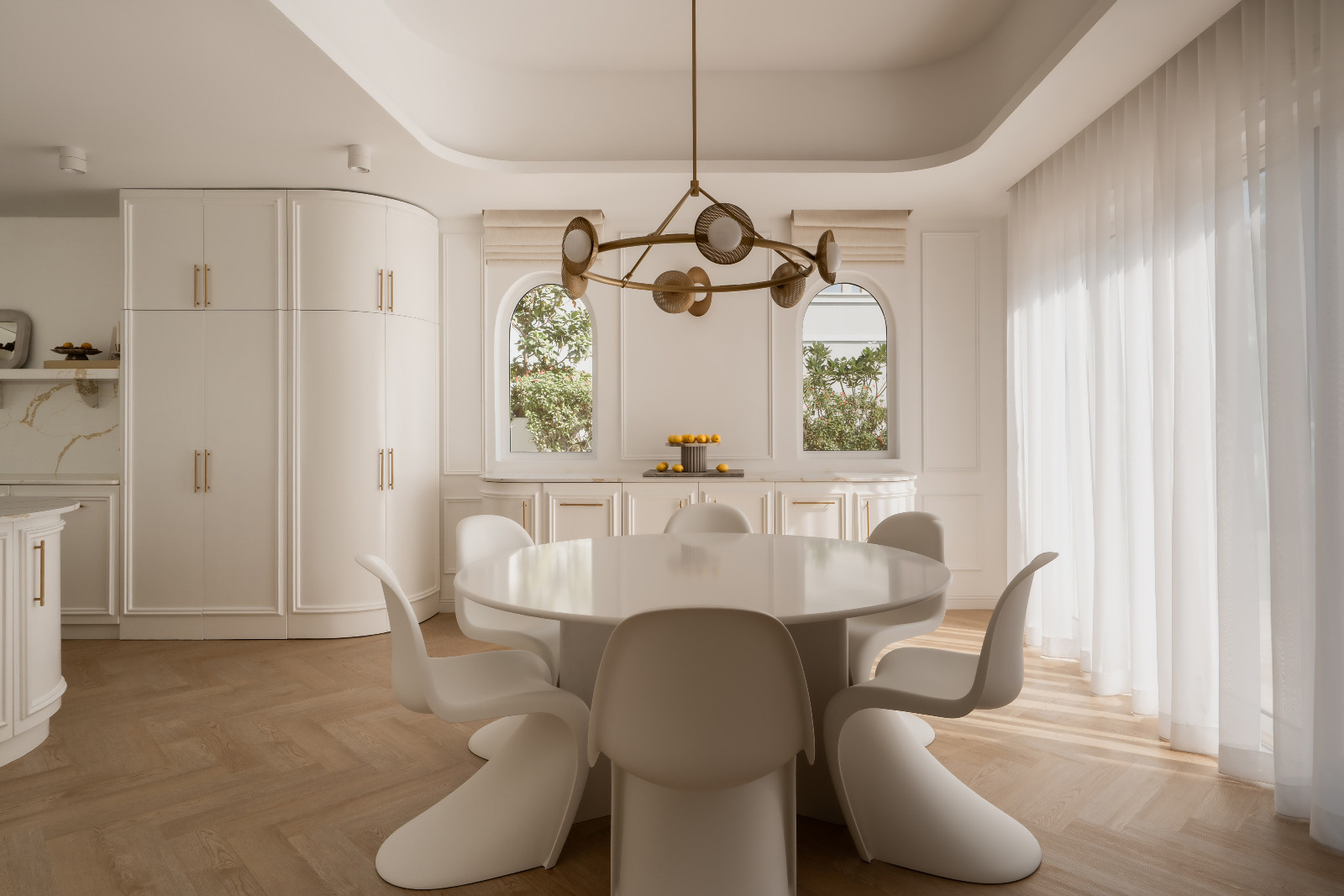 Pantone dining chairs by Vitra surround the bespoke quartz casual dining table
