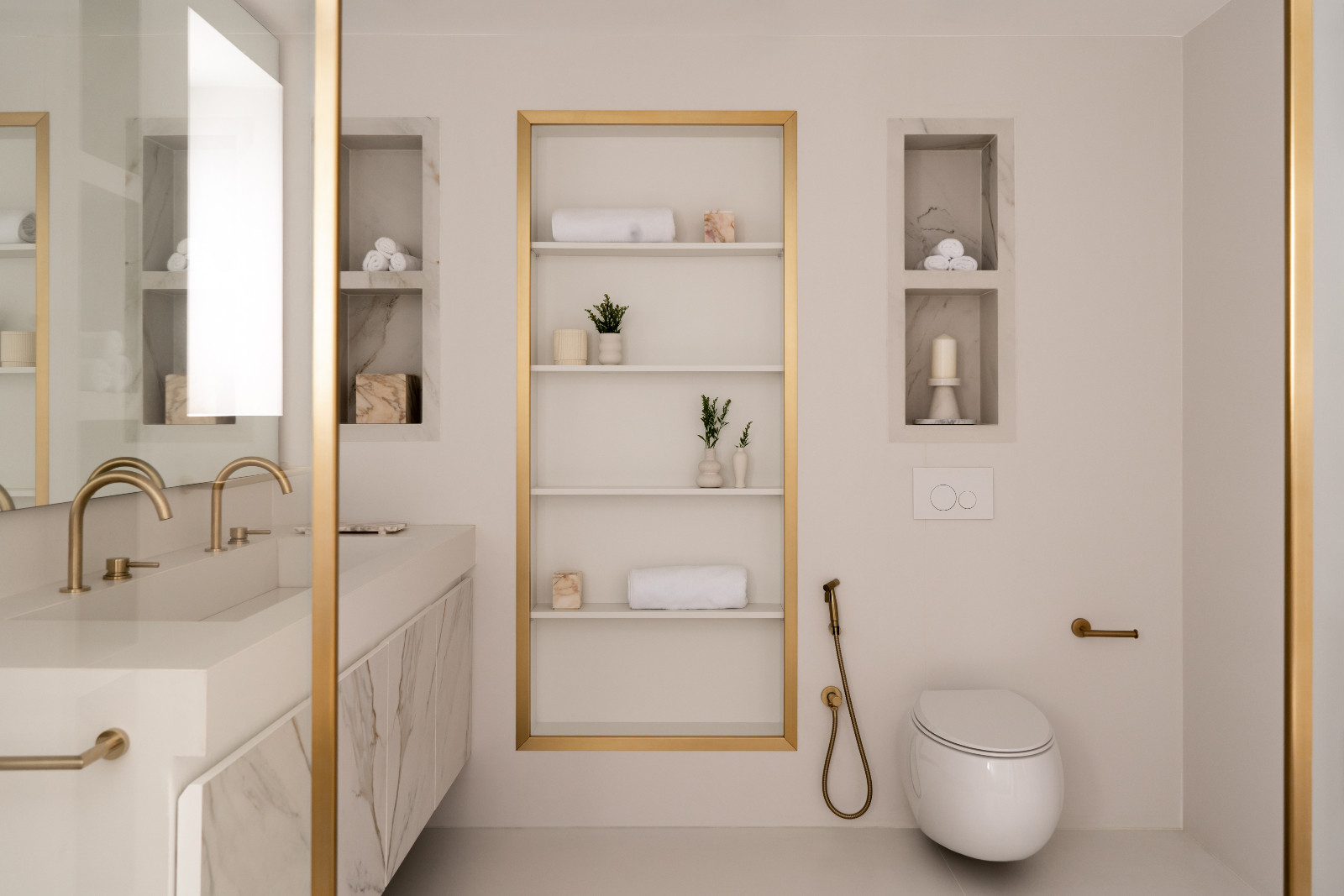 European architectural features of Spanish tiles and brass detailing bring symmetry in contrast to the scheme’s softer elements