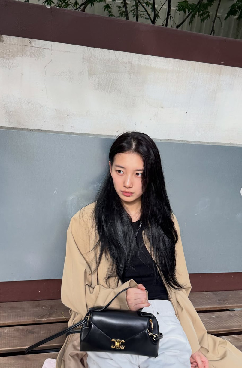 Actress and singer Bae Suzy carries her Celine Triomphe handbag.