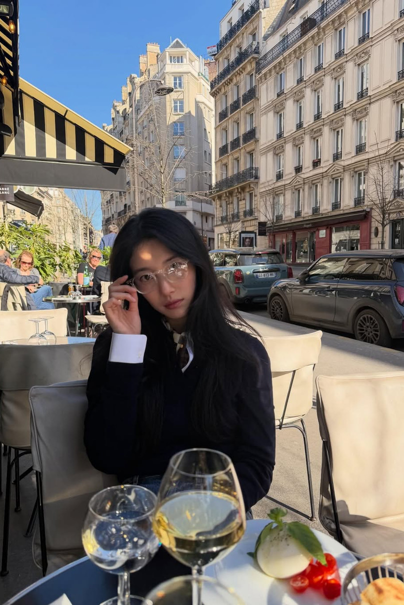 Bae Suzy enjoys a moment at an outdoor cafe in Paris.