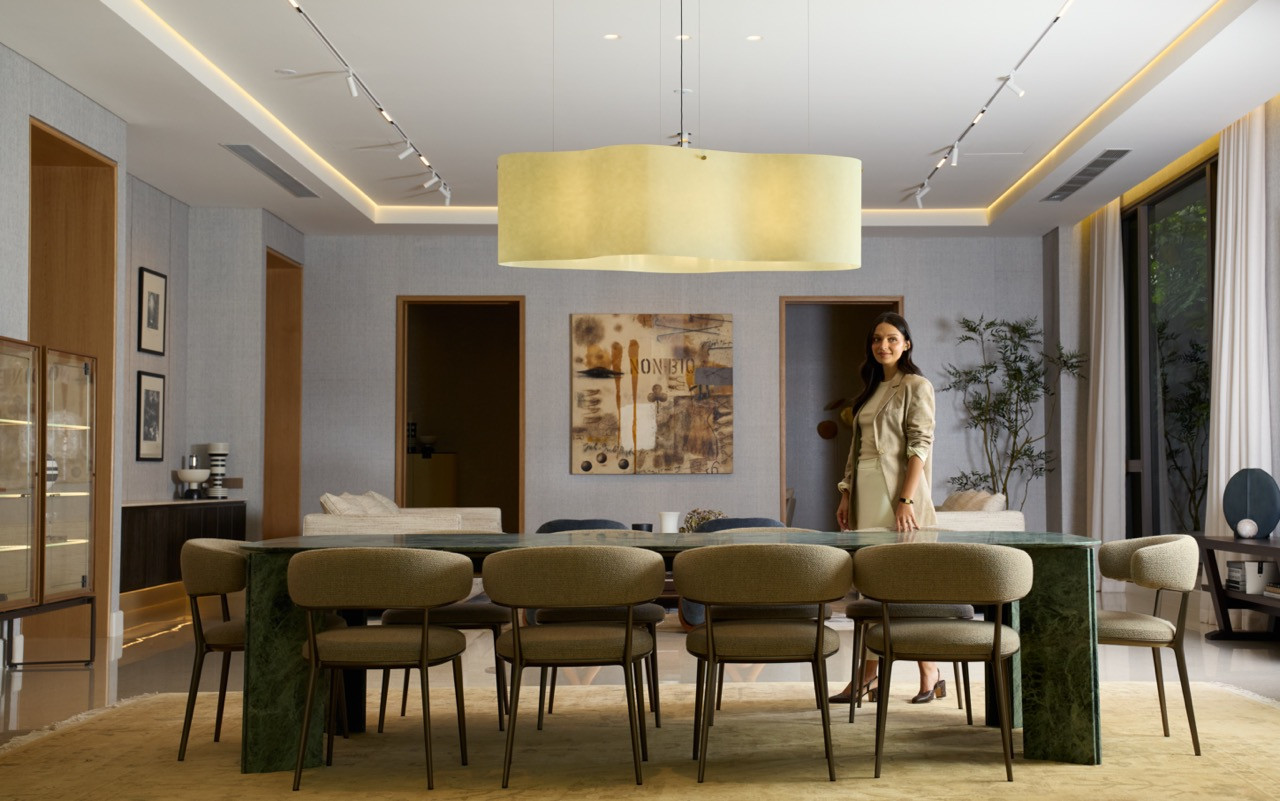 Yasmin in the dining area at Eden Taman Duta’s show unit, with the Acerbis Maxwell marble table
