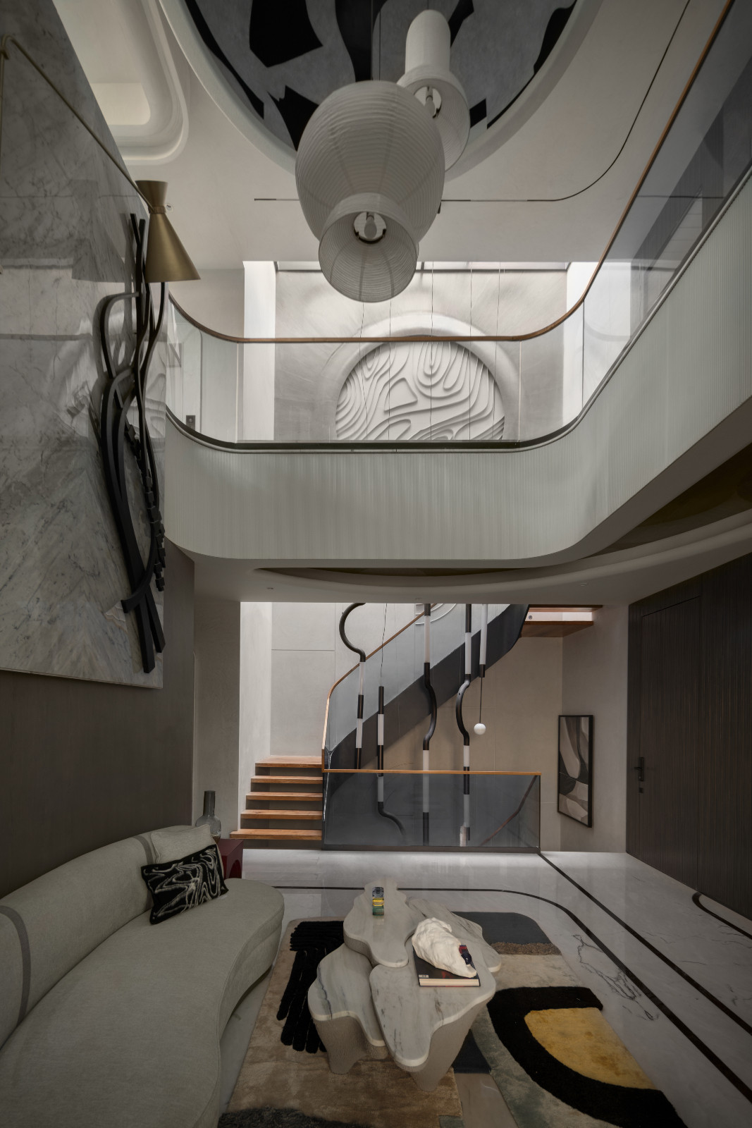The living room of an avant-garde family home with brutalist elements in New Delhi, India designed by Spaces Architects @KA