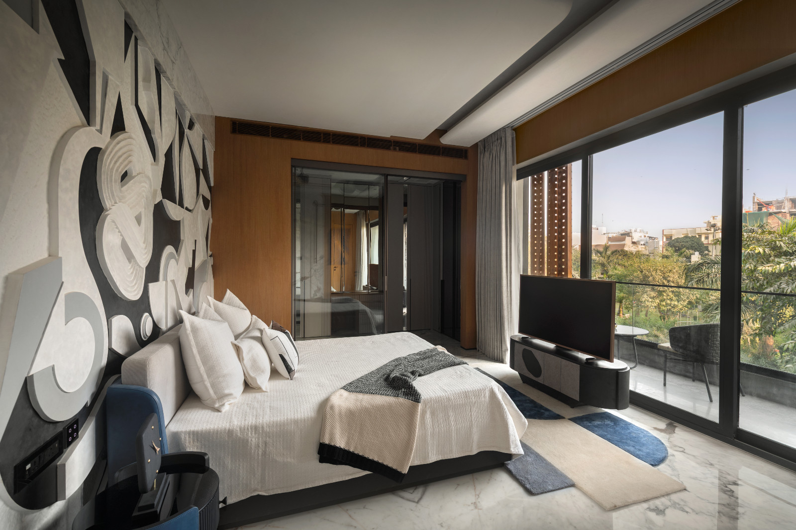 The bedroom of an avant-garde family home with brutalist elements in New Delhi, India designed by Spaces Architects @KA