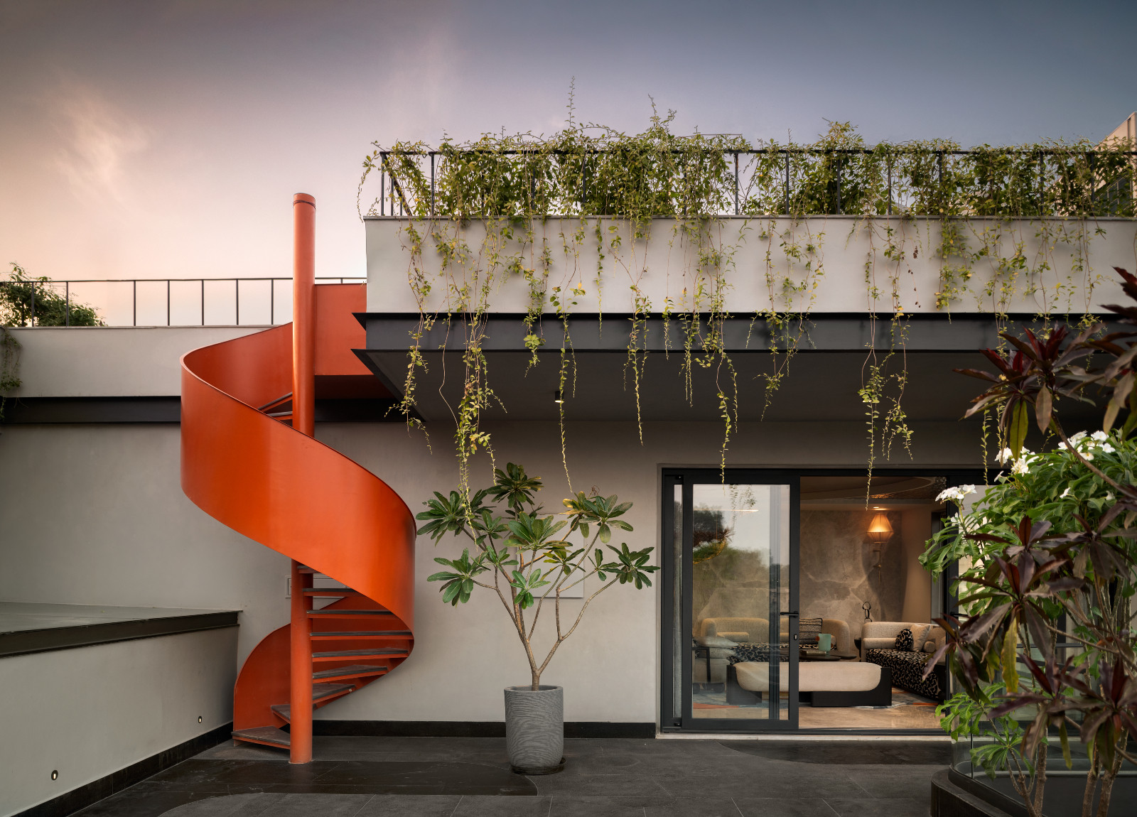 The garden and roof deck of an avant-garde family home with brutalist elements in New Delhi, India designed by Spaces Architects @KA