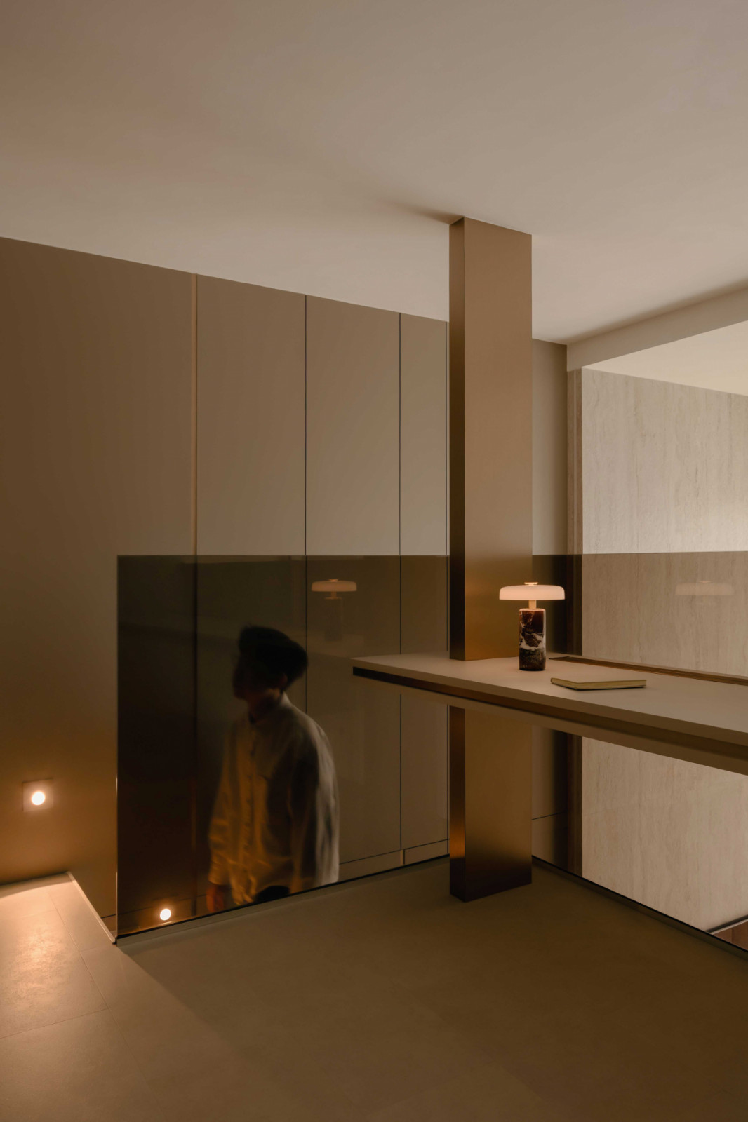 The loft study features a tinted glass railing
