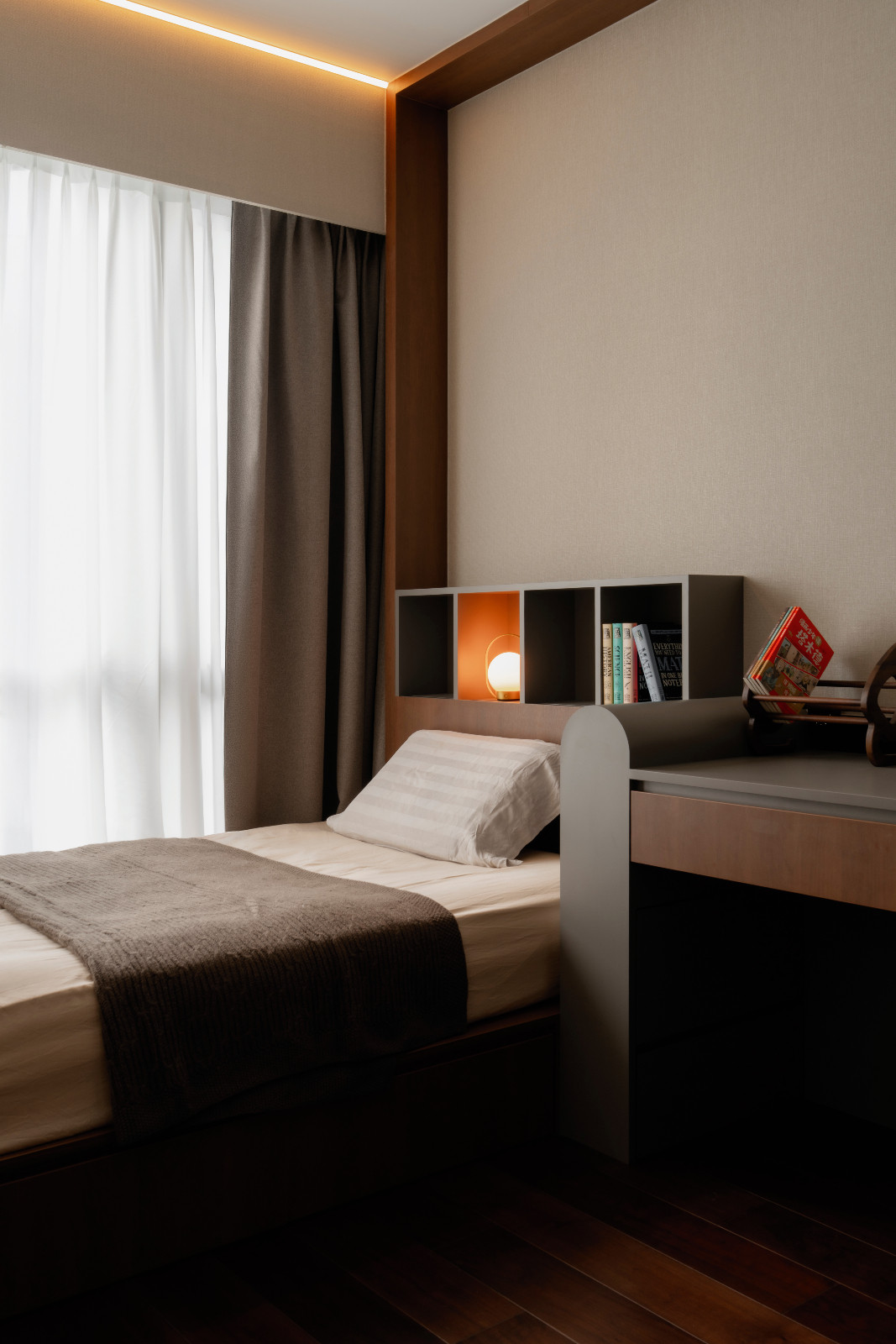 This bedroom is cloaked in warm, dark timber shades to encourage relaxation